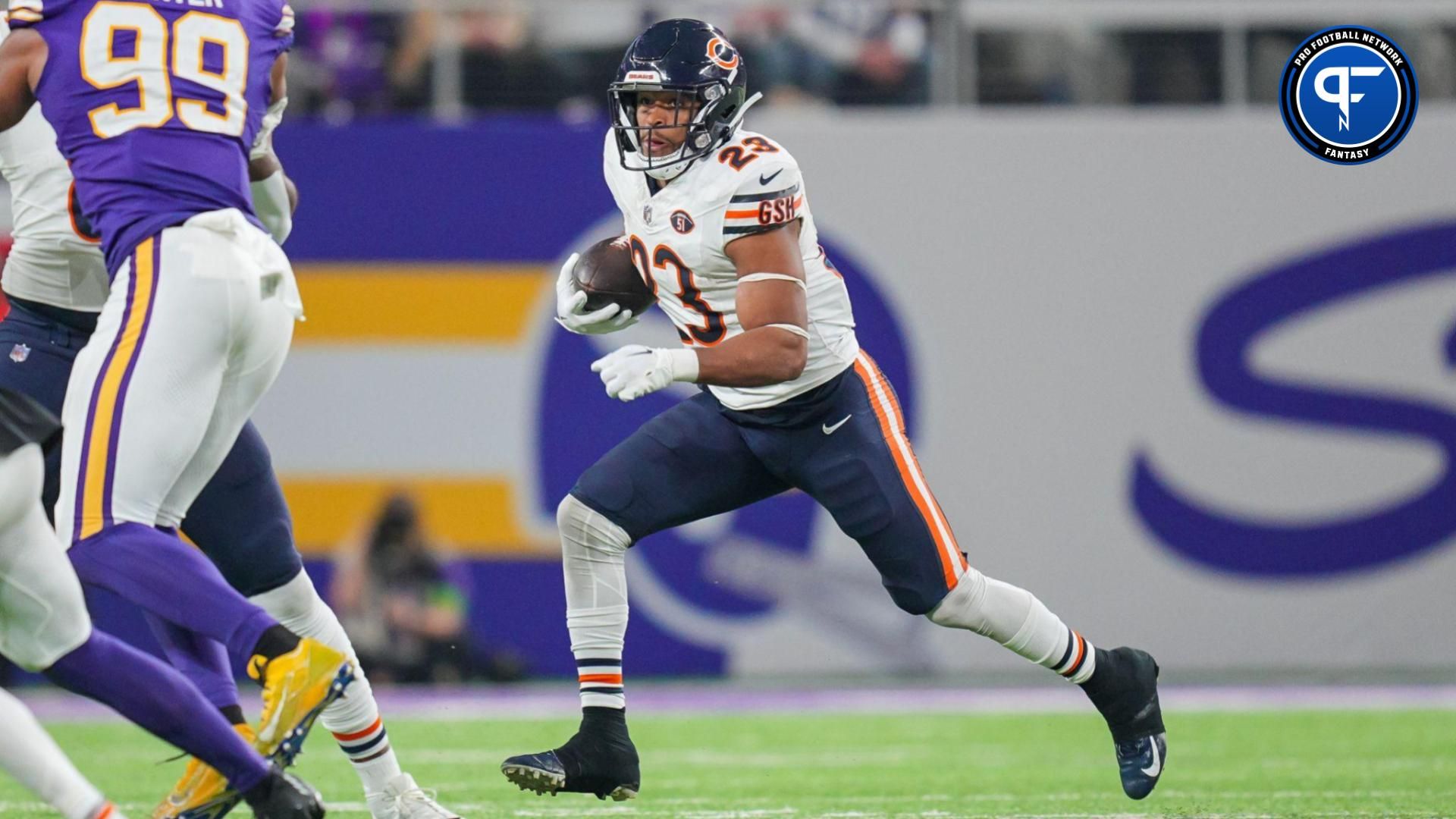 Chicago Bears running back Roschon Johnson (23) runs with the ball against the Minnesota Vikings in the third quarter at U.S. Bank Stadium.