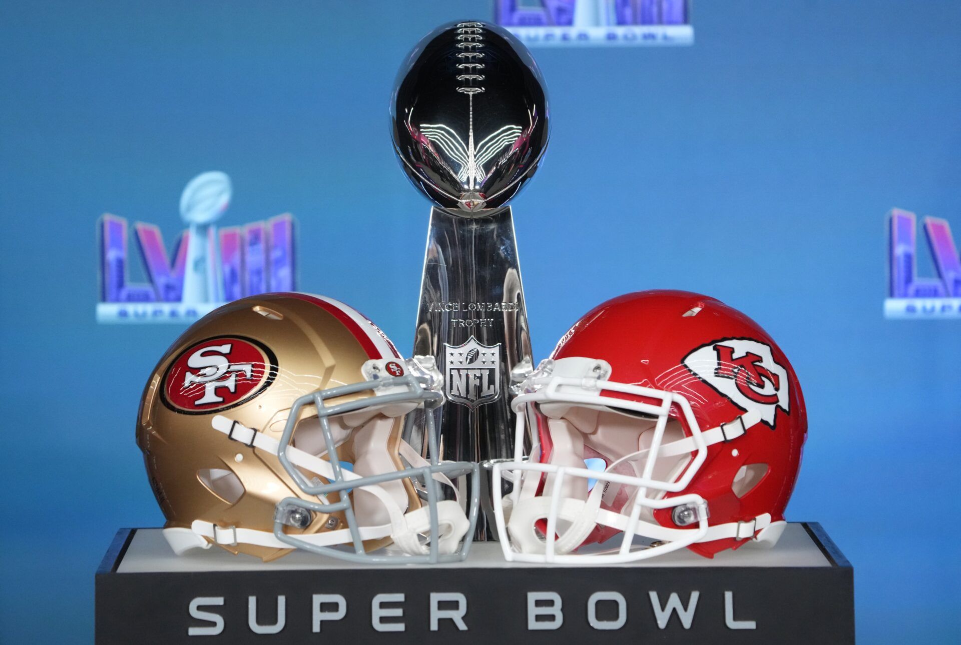 Helmets for the San Francisco 49ers and Kansas City Chiefs on display with the Vince Lombardi Trophy.