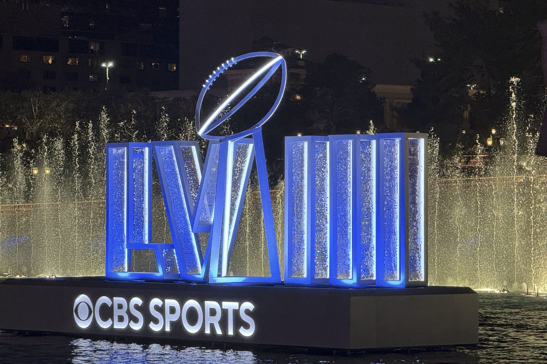 Super Bowl 58 numerals and CBS Sports logo at the Bellagio fountains on the Las Vegas strip.