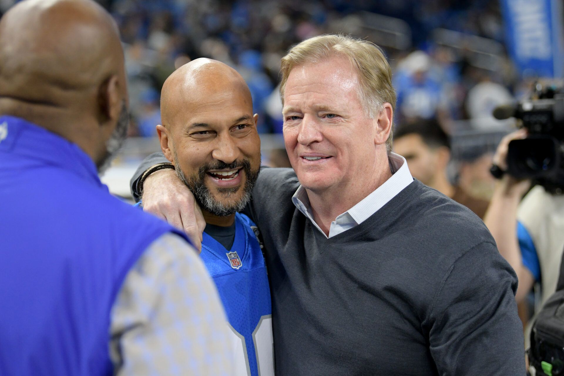 Comedian/actor Keegan-Michael Key talks with NFL Commissioner, Roger Goodell, (right) before the Detroit Lions game against the Chicago Bears at Ford Field.