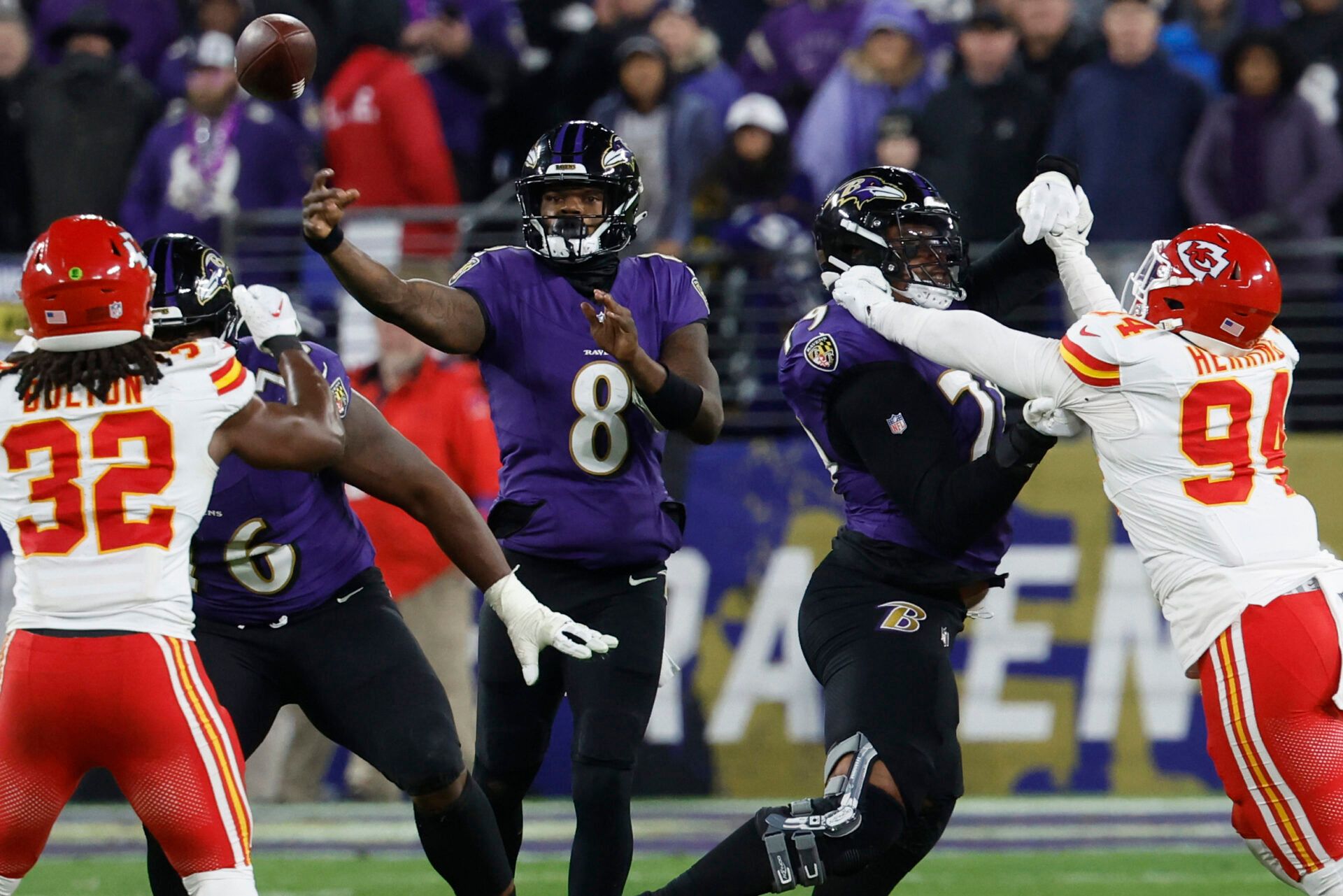 Baltimore Ravens quarterback Lamar Jackson (8) passes the ball against the Kansas City Chiefs in the AFC Championship football game at M&T Bank Stadium.