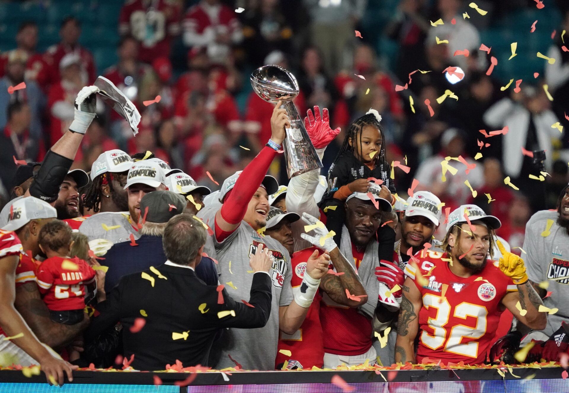 Kansas City Chiefs quarterback Patrick Mahomes (15) hoist the Vince Lombardi Trophy after defeating the San Francisco 49ers in Super Bowl LIV at Hard Rock Stadium.