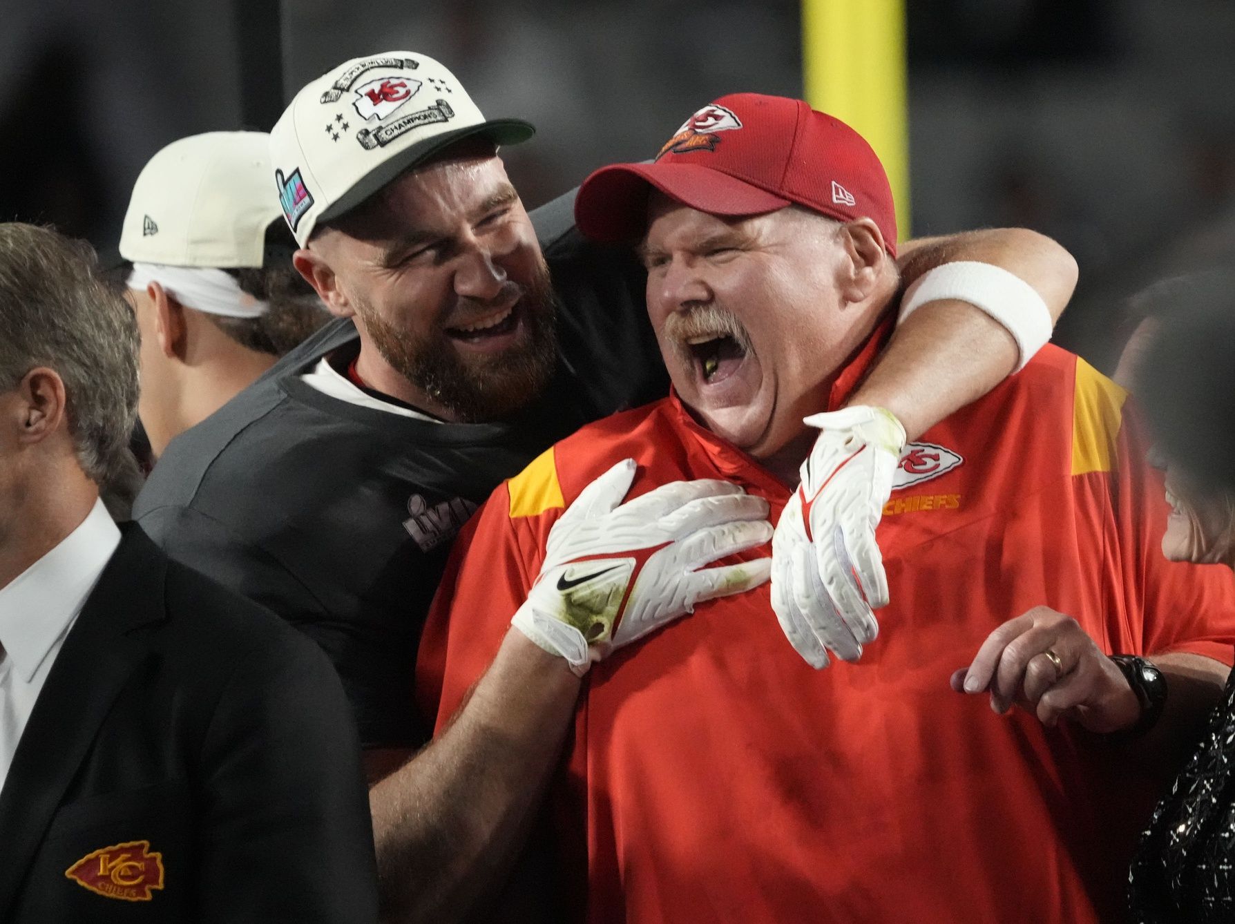 Kansas City Chiefs head coach Andy Reid and tight end Travis Kelce celebrate after defeating the Philadelphia Eagles in Super Bowl LVII at State Farm Stadium.