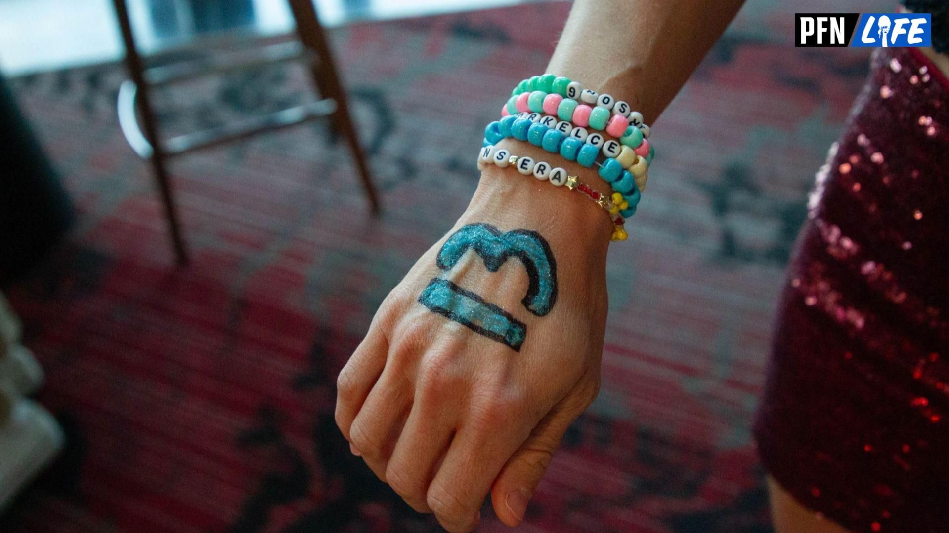 This fan painted Taylor Swift's lucky number 13 on their hand.