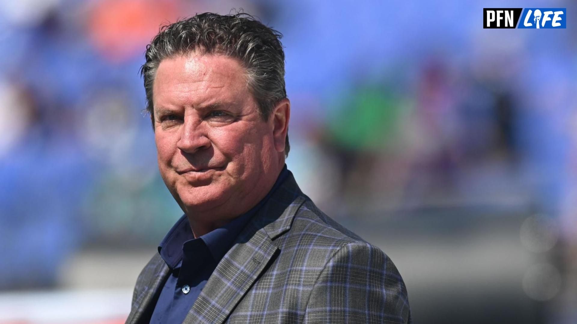 Dan Marino, Pro Football Hall of Fame class of 2005, stands on the field before the game between the Baltimore Ravens and the Miami Dolphins at M&T Bank Stadium.