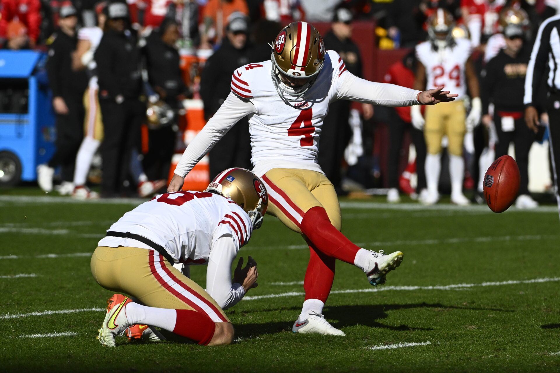 San Francisco 49ers place kicker Jake Moody (4) kicks a field goal against the Washington Commanders during the first half at FedExField.