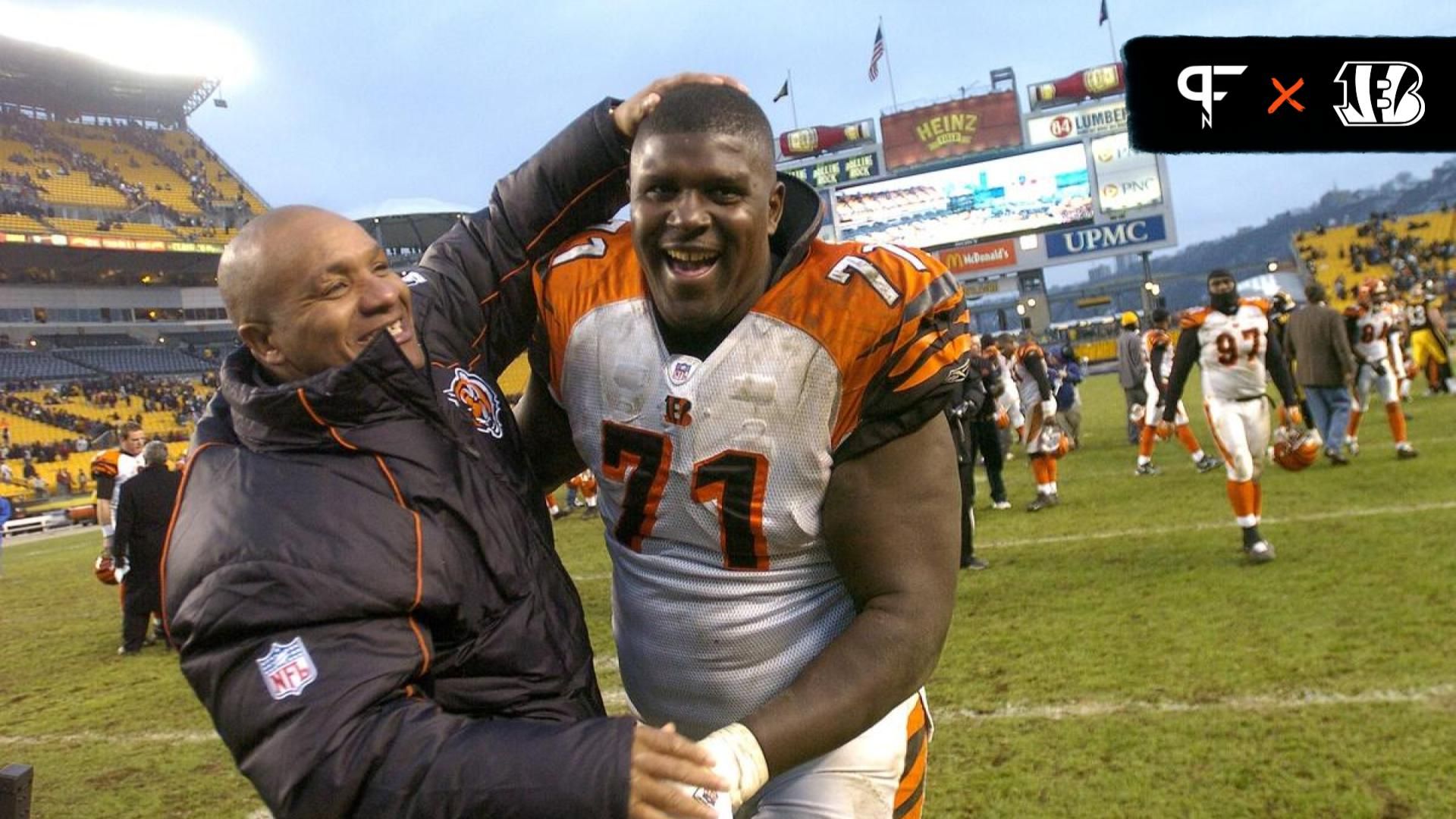 The Cincinnati Bengals offensive tackle Willie Anderson is congratulated by wide receiver coach Hue Jackson for their 38-31 win against the Pittsburgh Steelers at Heinz Field.