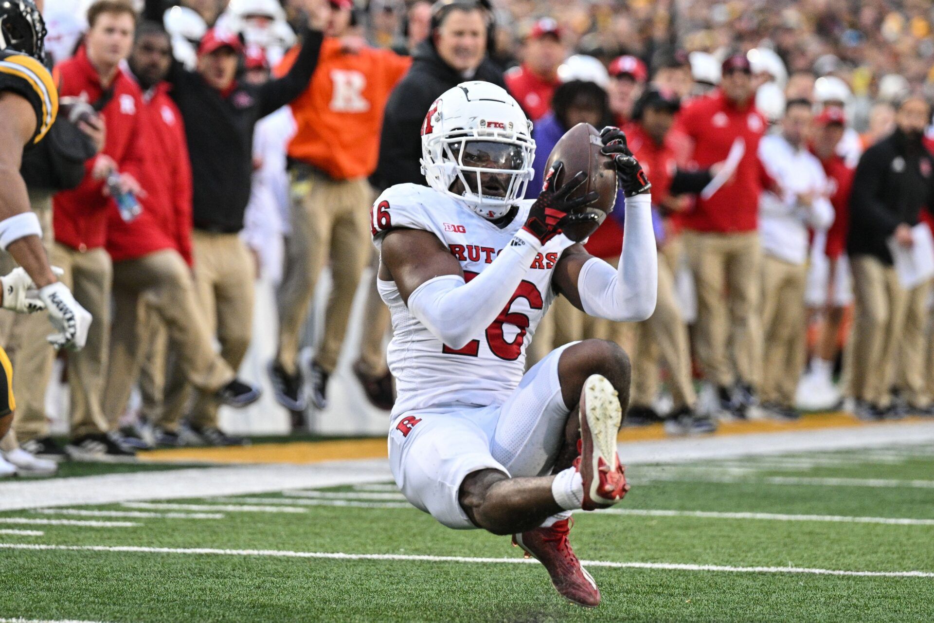 Rutgers Scarlet Knights defensive back Max Melton (16) intercepts a pass from Iowa Hawkeyes quarterback Deacon Hill (not pictured) during the second quarter at Kinnick Stadium.