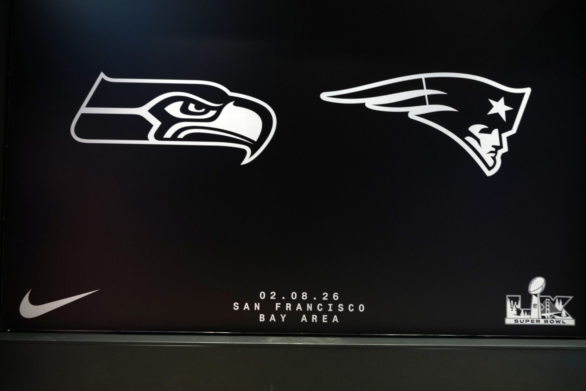 A Super Bowl LX display with the Seattle Seahawks and New England Patriots logos at Nike San Francisco.