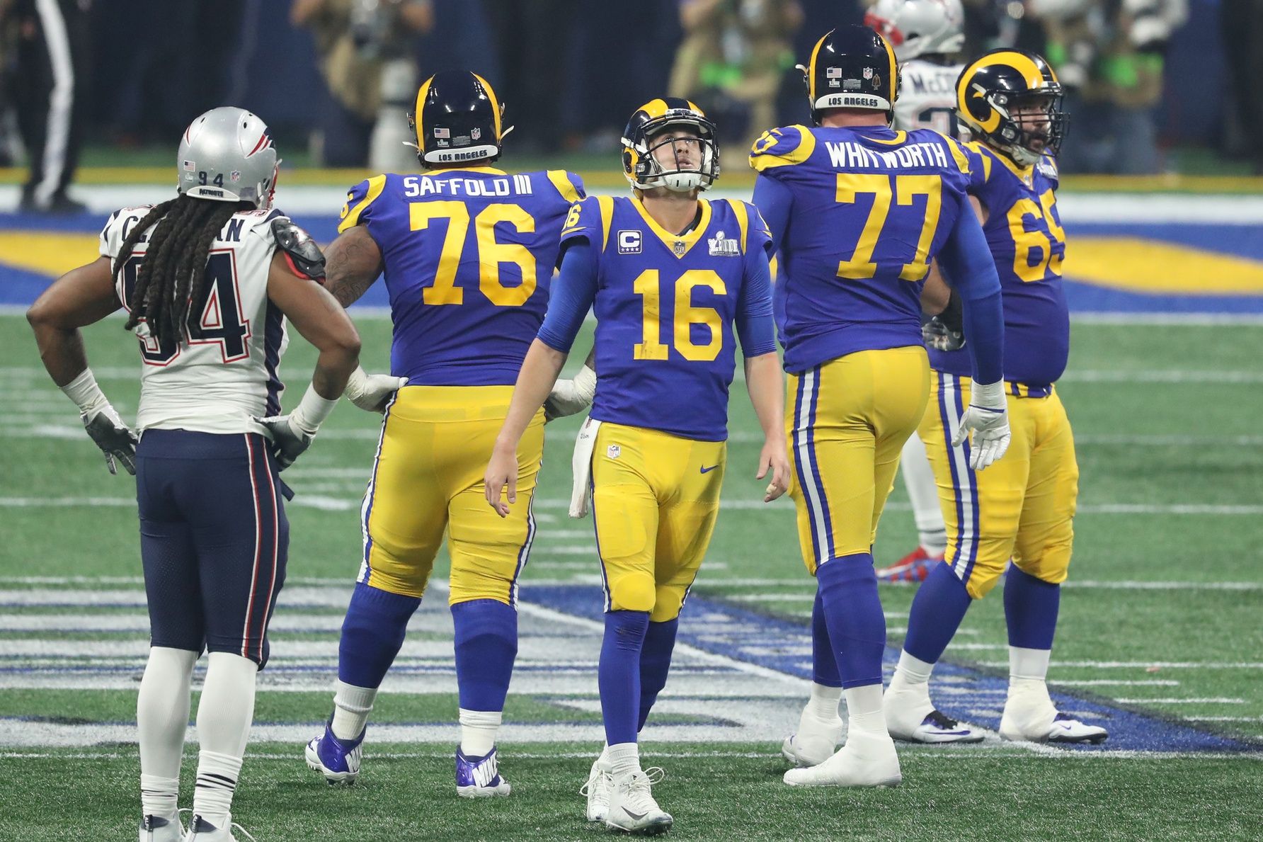 Los Angeles Rams quarterback Jared Goff (16) reacts after throwing an incomplete pass against the New England Patriots during the fourth quarter of Super Bowl LIII at Mercedes-Benz Stadium.