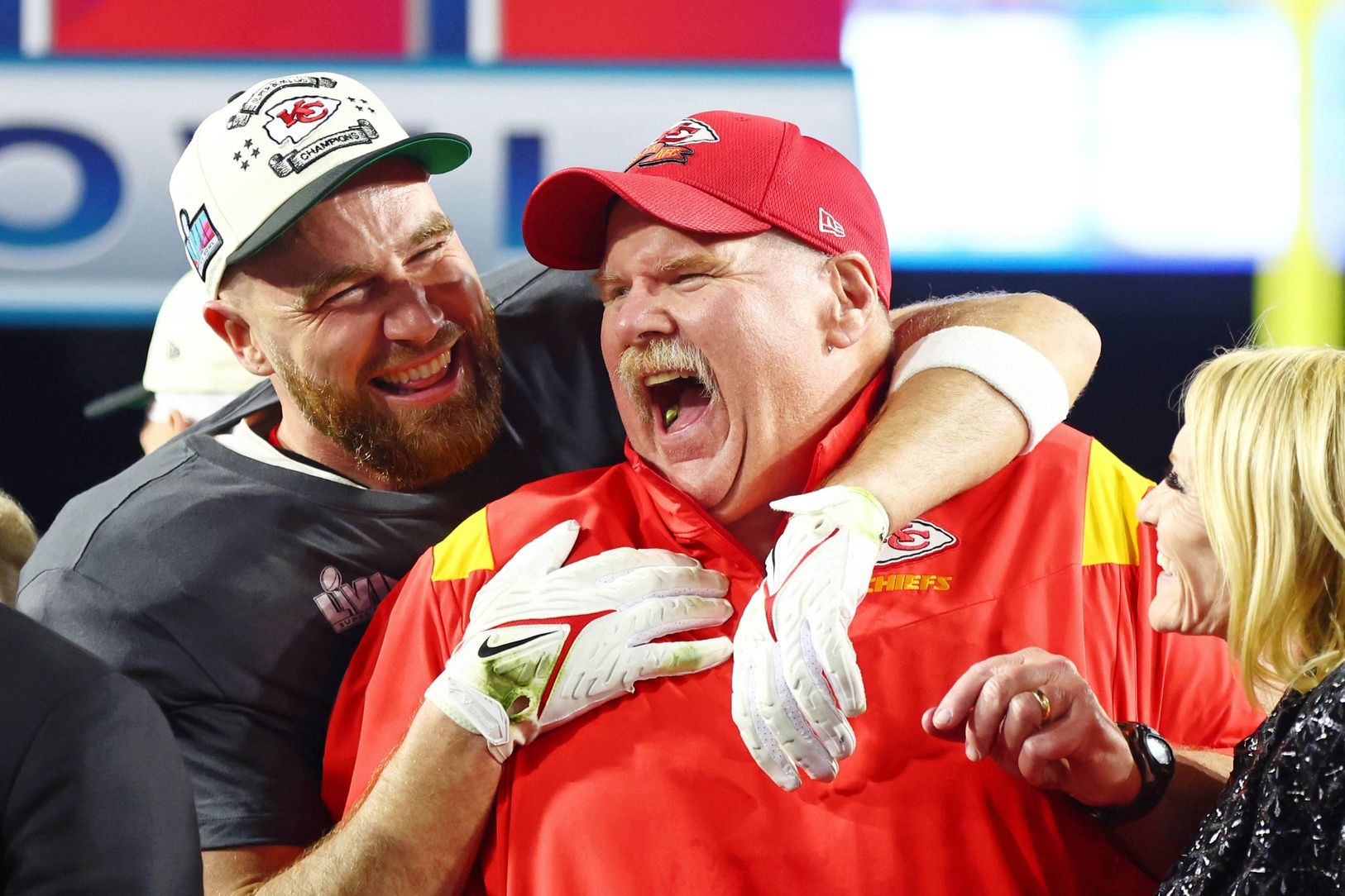 Kansas City Chiefs tight end Travis Kelce (87) celebrates with head coach Andy Reid after winning Super Bowl LVII against the Philadelphia Eagles at State Farm Stadium.