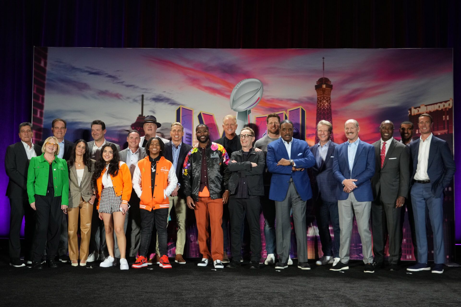 The CBS Sports on-air broadcast team including Sean McManus, David Berson, Jim Nantz, Tony Romo, Tracy Wolfson, Evan Washburn, Jay Feely, Gene Steratore, Nate Burleson, Dylan Gilmer (Young Dylan), JJ Watt, Bill Cowher, Jonathan Jones, James Brown, Phil Simms and Boomer Esiason pose at press conference at the Super Bowl 58 Media Center at the Mandalay Bay Resort and Casino.