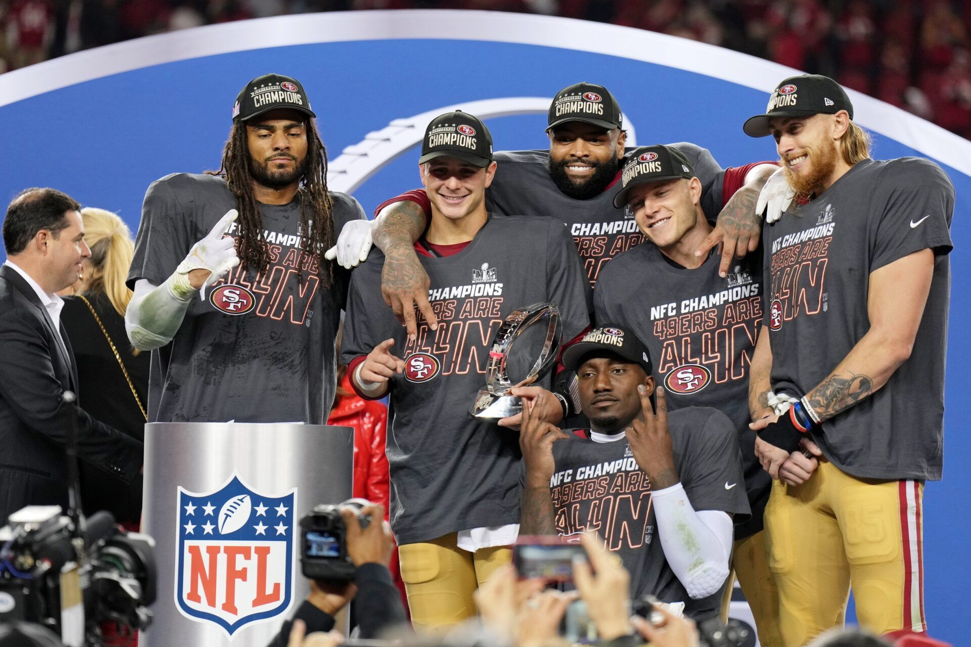 San Francisco 49ers linebacker Fred Warner (54), quarterback Brock Purdy (13), offensive tackle Trent Williams (71), wide receiver Deebo Samuel (19), running back Christian McCaffrey (23), tight end George Kittle (85) celebrate after winning the NFC Championship football game against the Detroit Lions at Levi's Stadium.