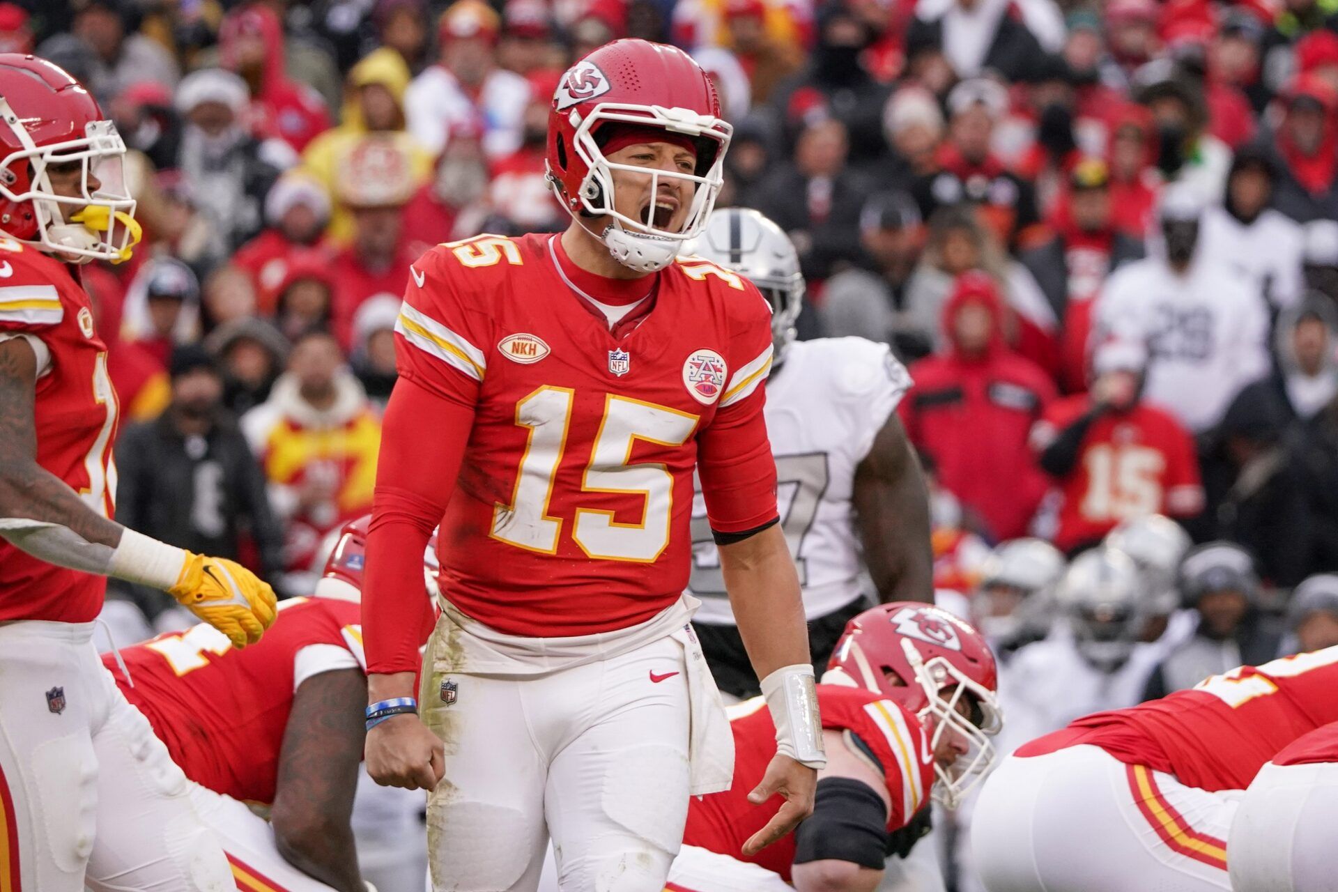 Kansas City Chiefs quarterback Patrick Mahomes (15) yells toward the sidelines against the Las Vegas Raiders during the game at GEHA Field at Arrowhead Stadium.