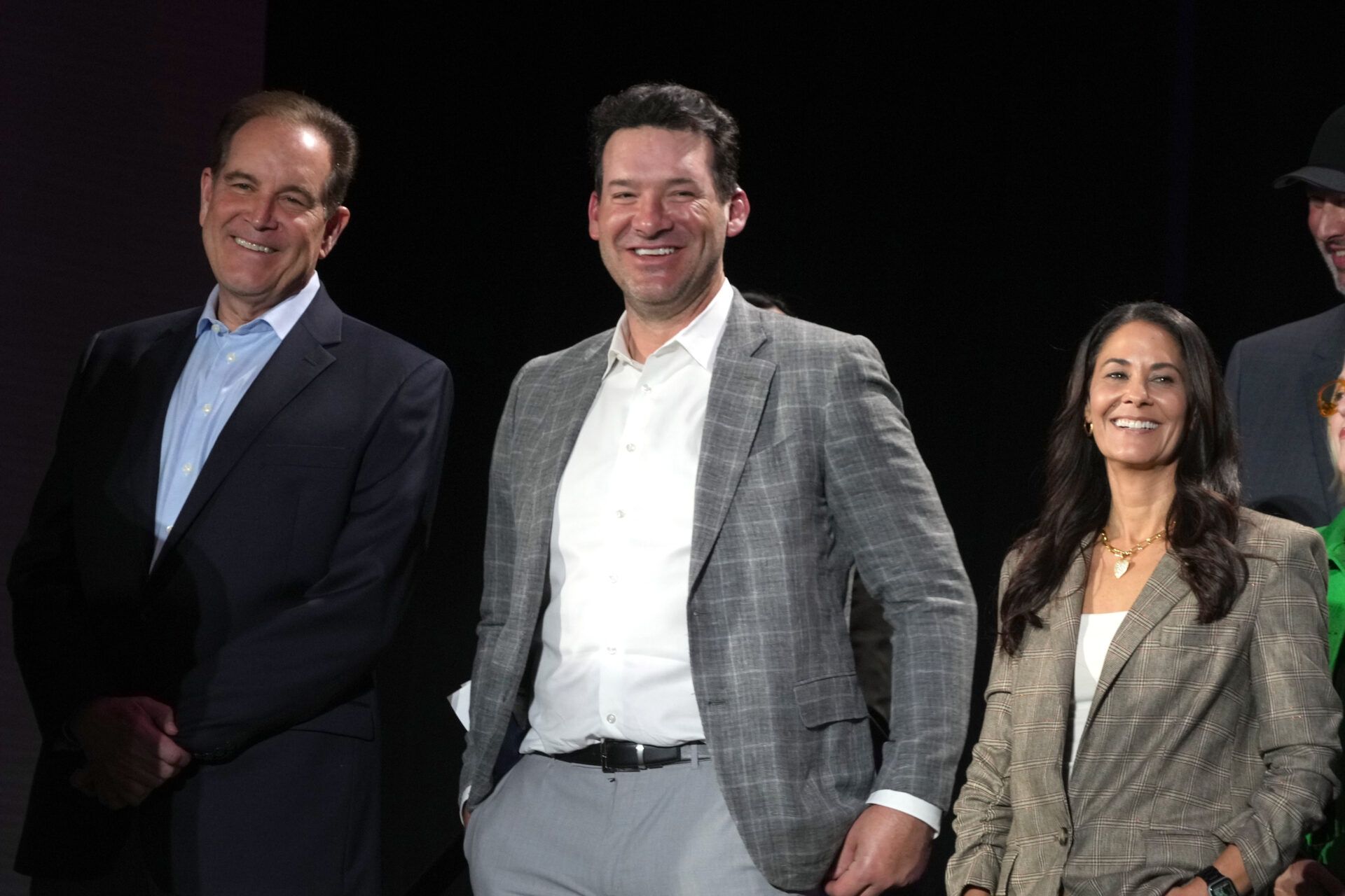 CBS Sports play-by-play announcer Jim Nantz (left), analyst Tony Romo (center) and sideline reporter Tracy Wolfson at press conference at the Super Bowl 58 Media Center at the Mandalay Bay Resort and Casino.