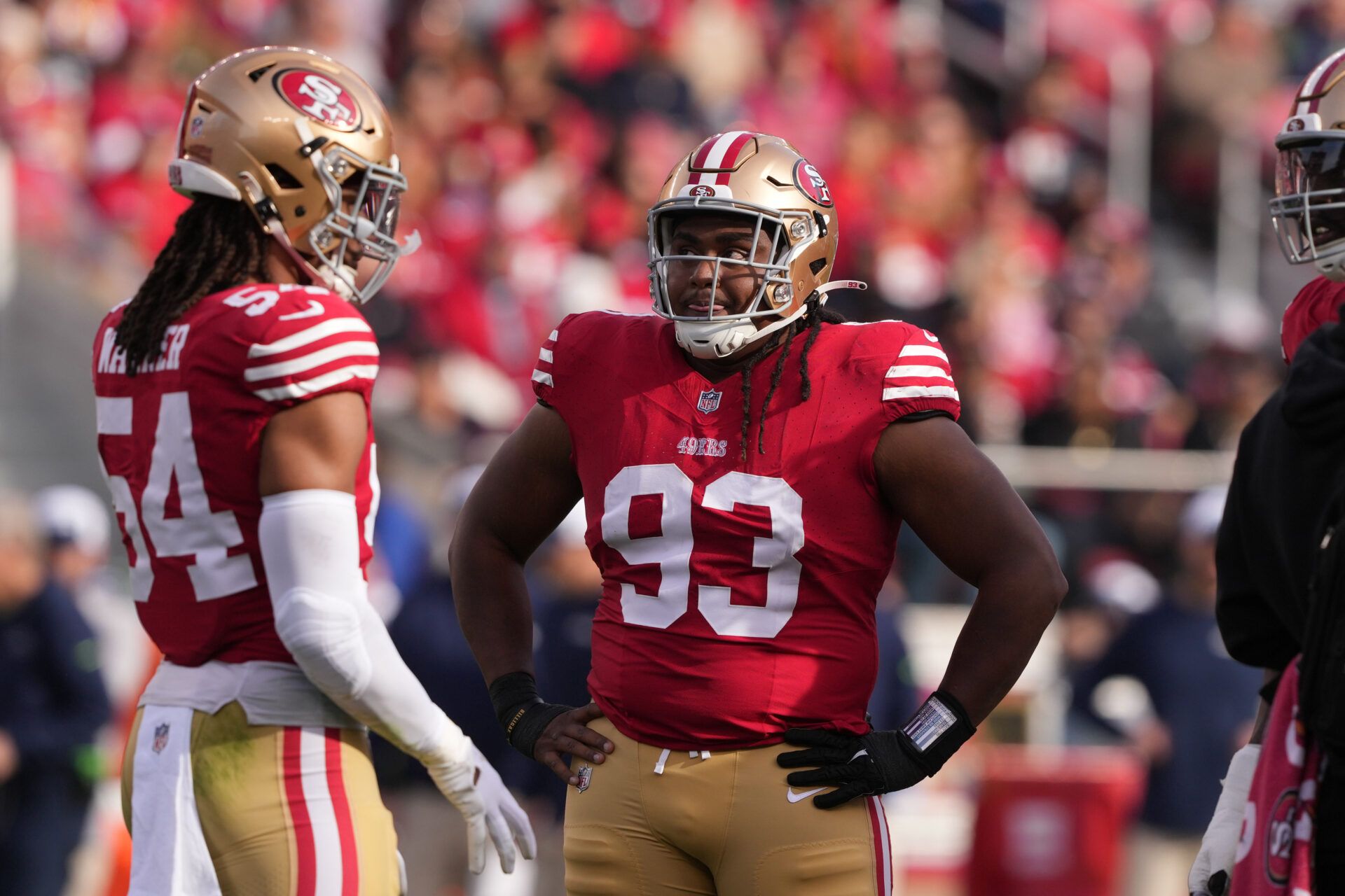 San Francisco 49ers defensive tackle Kalia Davis (93) stands on the field with linebacker Fred Warner (54) during the first quarter against the Seattle Seahawks at Levi's Stadium.