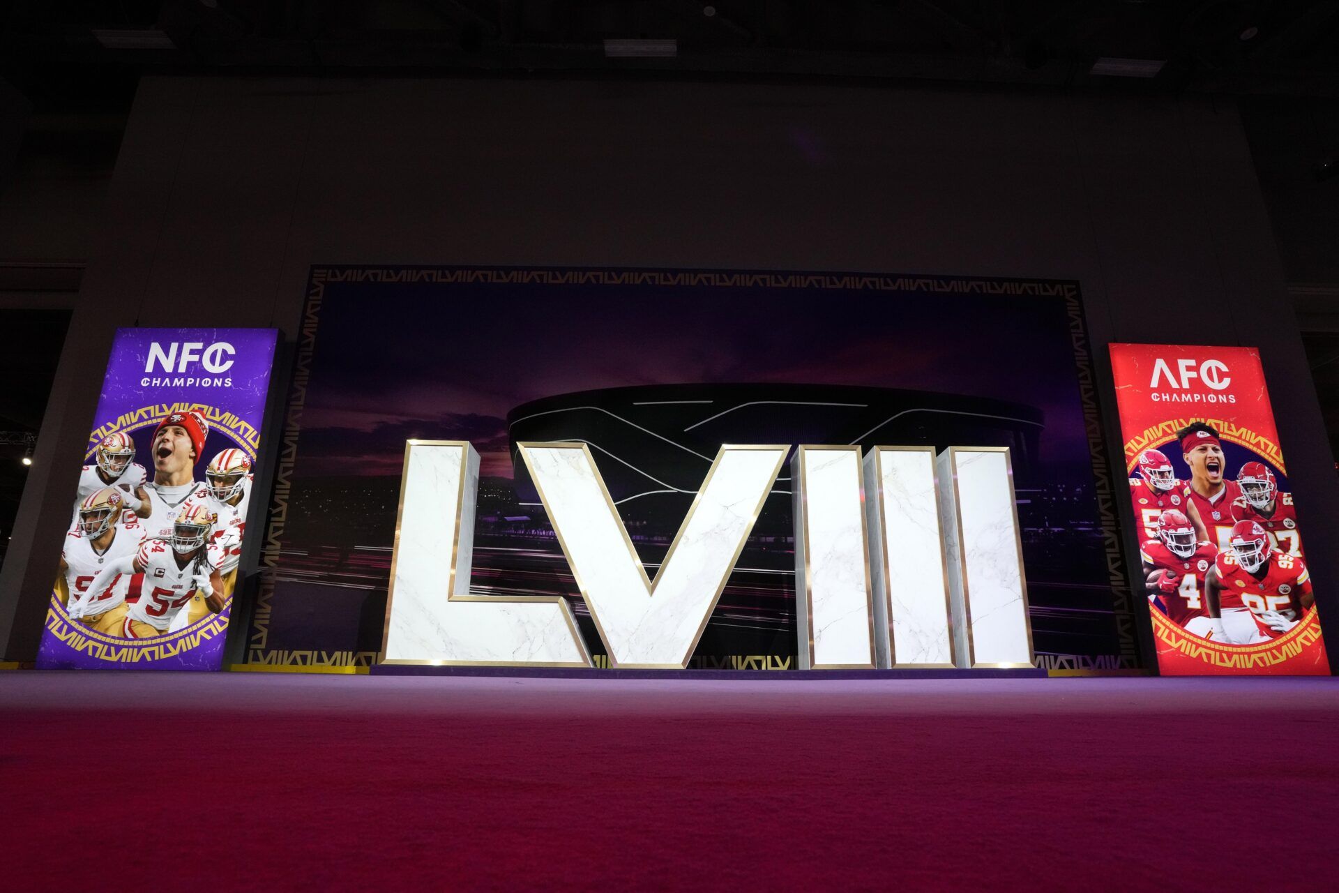 The Super Bowl 58 roman numerals at the NFL Experience with images of San Francisco 49ers running back Christian McCaffrey (23), quarterback Brock Purdy (13), tight end George Kittle (85), defensive end Nick Bosa (97) and linebacker Fred Warner (54) and Kansas City Chiefs center Creed Humphrey (52), quarterback Patrick Mahomes (15), tight end Travis Kelce (87), wide receiver Rashee Rice (4) and defensive tackle Chris Jones (95) at the Mandalay Bay South Convention Center.