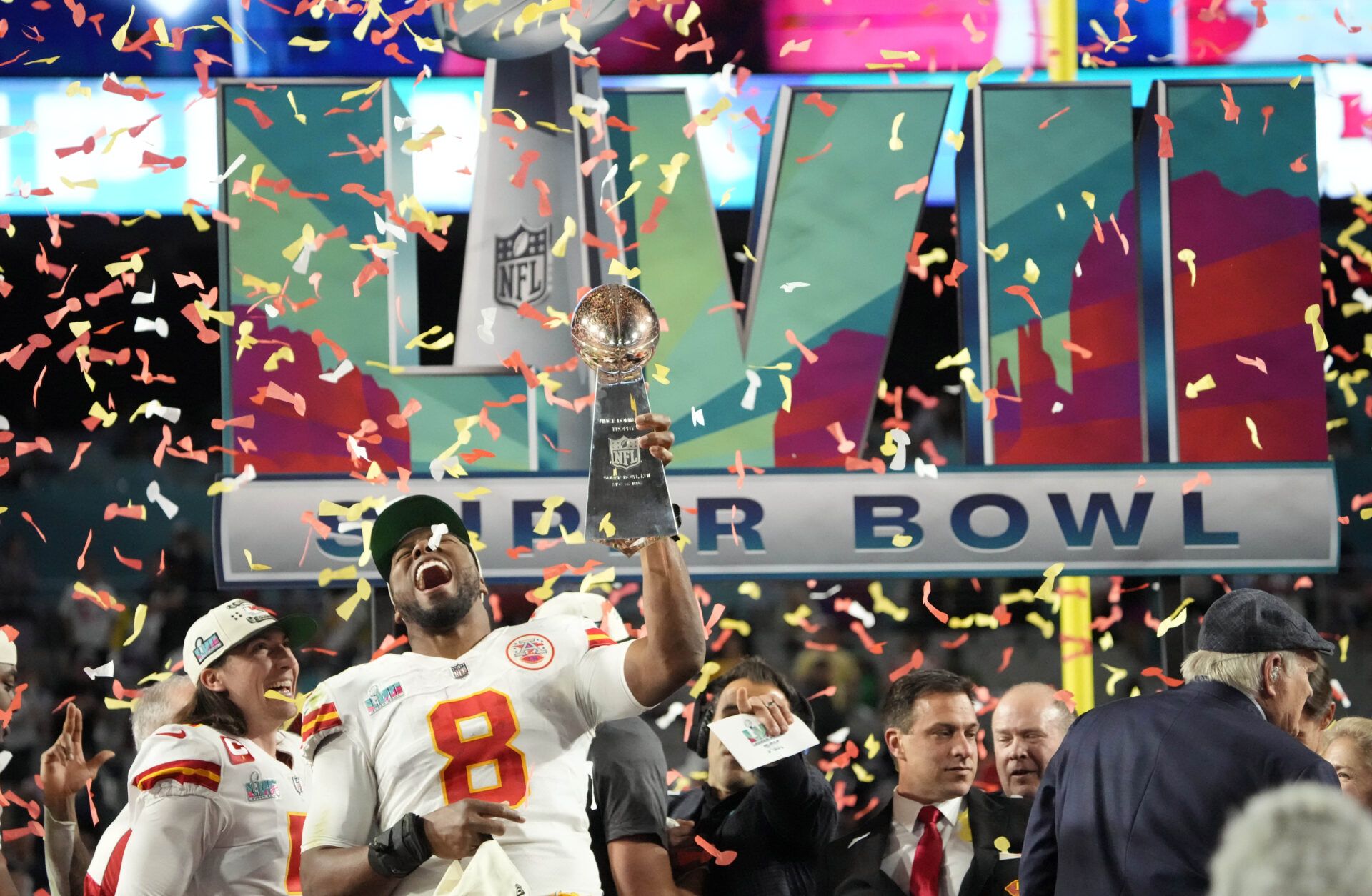 Kansas City Chiefs defensive end Carlos Dunlap (8) celebrates with the Lombardi Trophy after defeating the Philadelphia Eagles in Super Bowl LVII at State Farm Stadium in Glendale on Feb. 12, 2023.