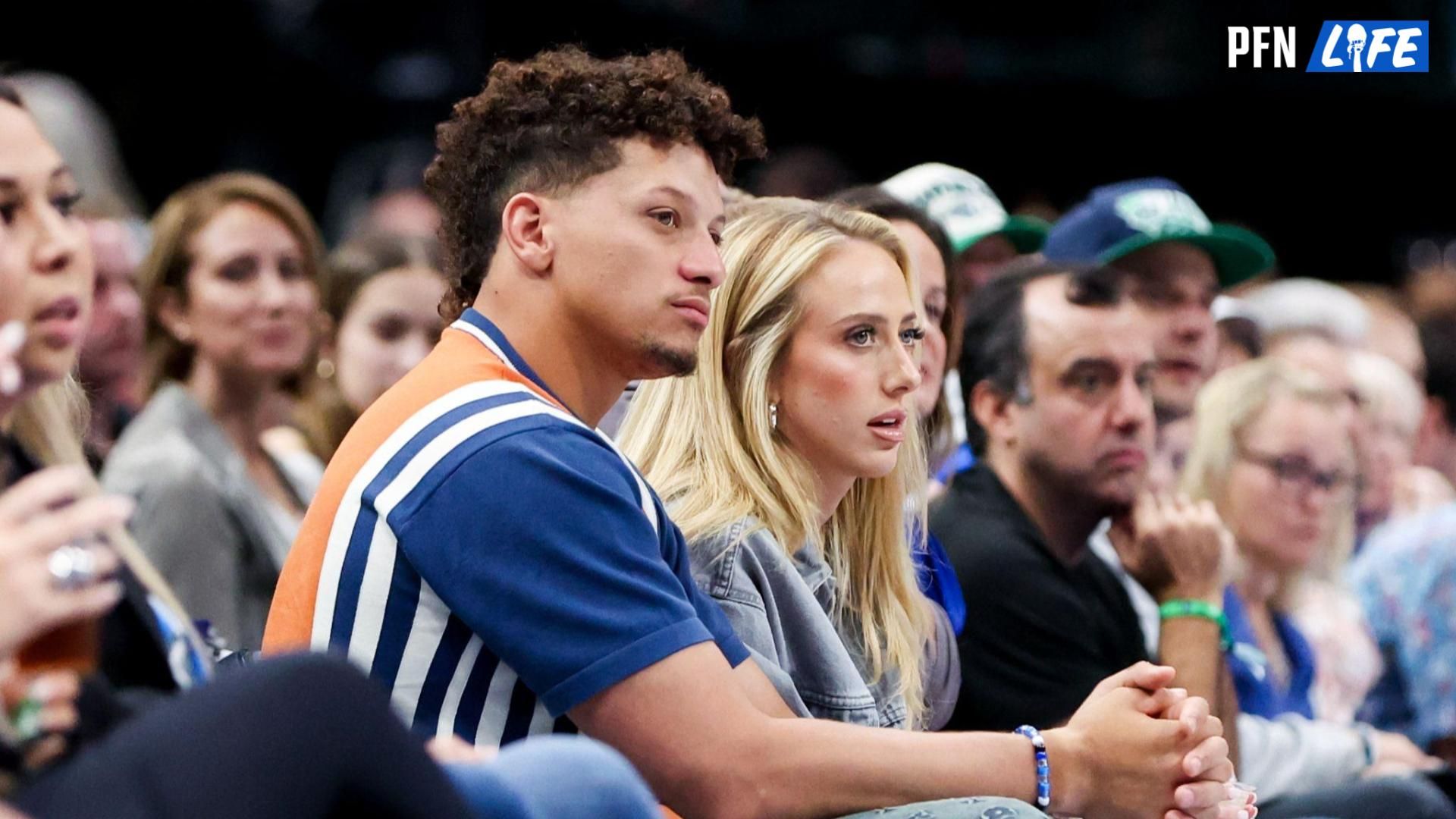 Kansas City Chiefs quarterback Patrick Mahomes II and his wife Brittany watch the game between the Dallas Mavericks and Toronto Raptors at American Airlines Center.