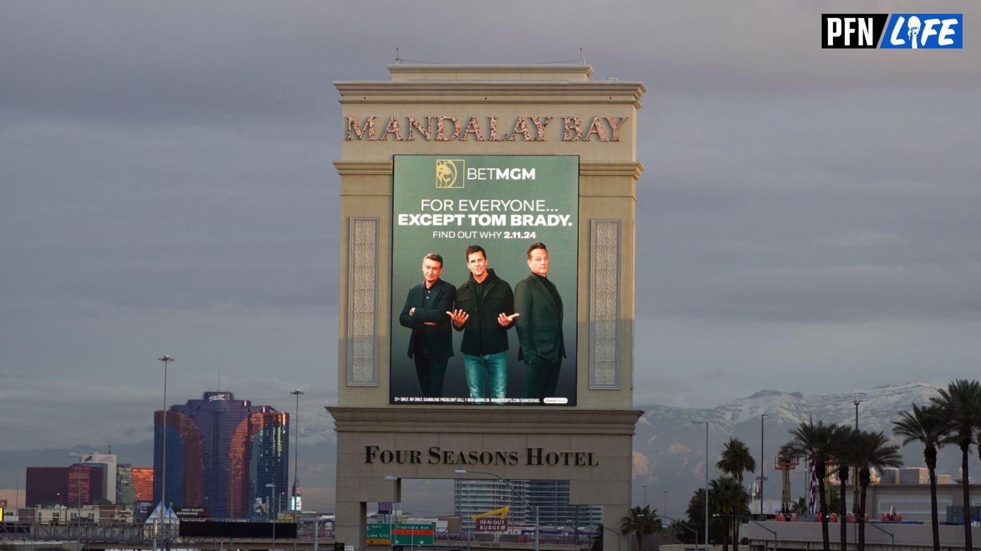 A BetMGM Sportsbook advertisement featuring Tom Brady on the Mandalay Bay resort and casino marquee sign prior to Super Bowl 58.