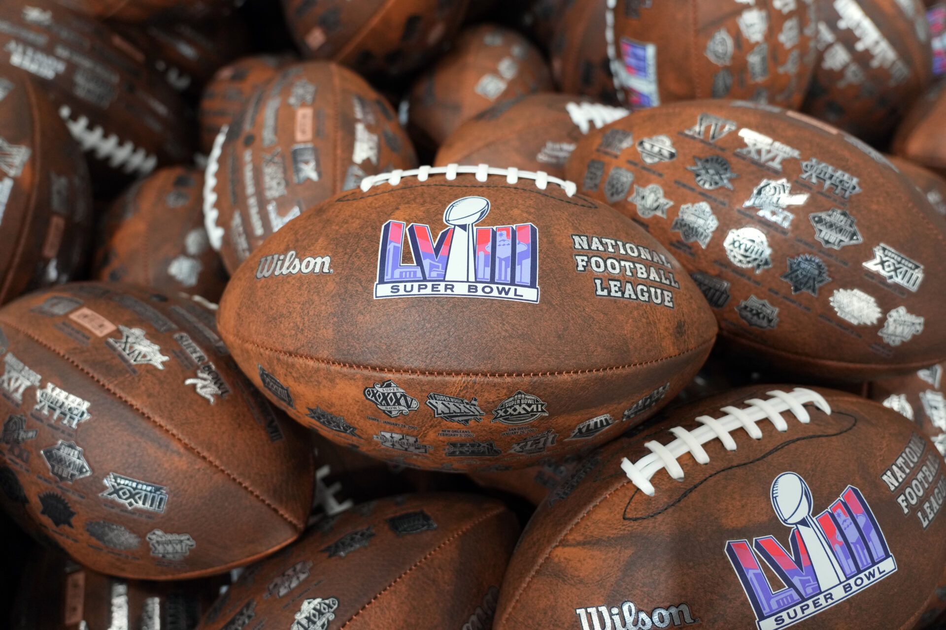 Wilson footballs with the Super Bowl 58 logo at the NFL Experience at the Mandalay Bay South Convention Center.