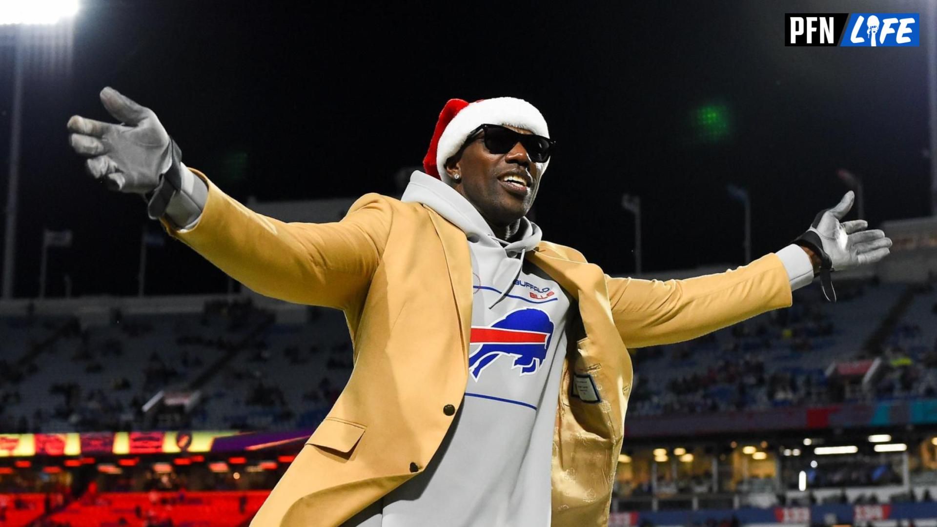 Former wide receiver Terrell Owens gestures to the crowd prior to the game between the New England Patriots and the Buffalo Bills at Highmark Stadium.