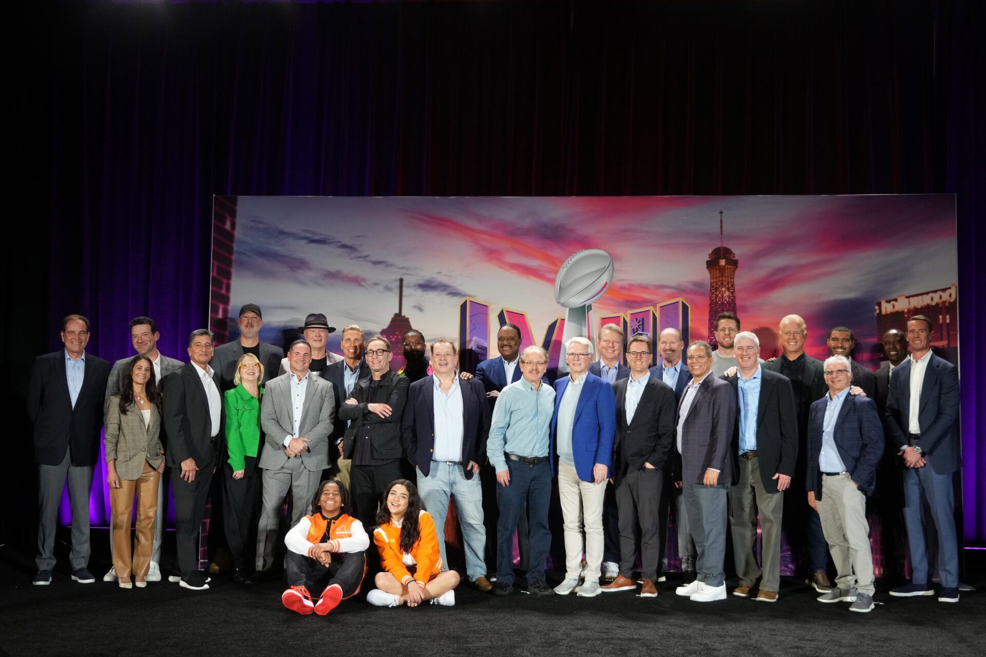 The CBS Sports on-air broadcast team including Sean McManus, David Berson, Jim Nantz, Tony Romo, Tracy Wolfson, Evan Washburn, Jay Feely, Gene Steratore, Nate Burleson, Dylan Gilmer (Young Dylan), JJ Watt, Bill Cowher, Jonathan Jones, James Brown, Phil Simms and Boomer Esiason pose at press conference at the Super Bowl 58 Media Center at the Mandalay Bay Resort and Casino.