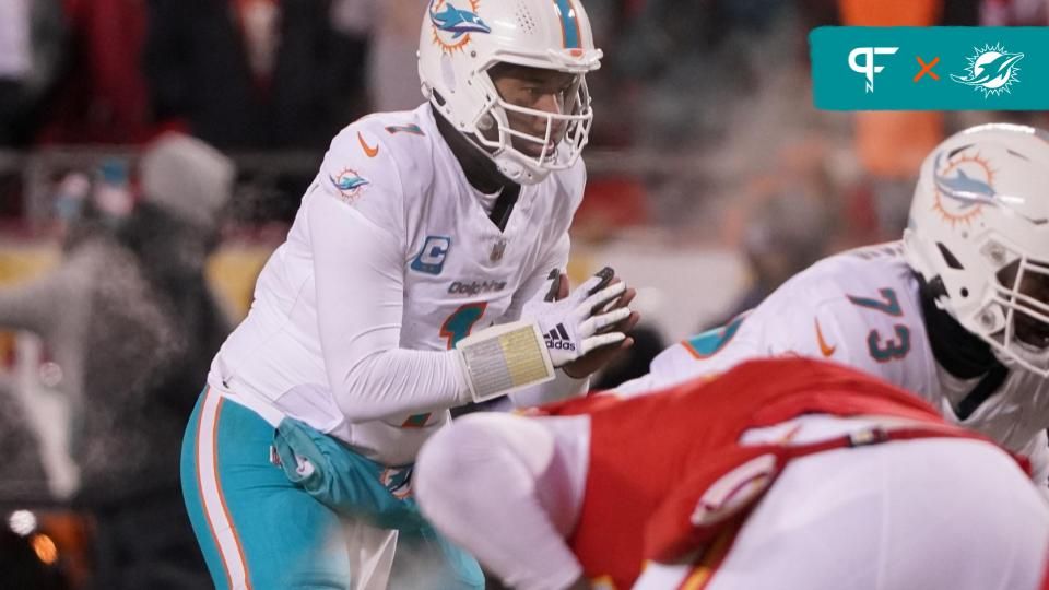 Miami Dolphins quarterback Tua Tagovailoa (1) before taking the snap against the Kansas City Chiefs during the second half of the 2024 AFC wild card game at GEHA Field at Arrowhead Stadium.