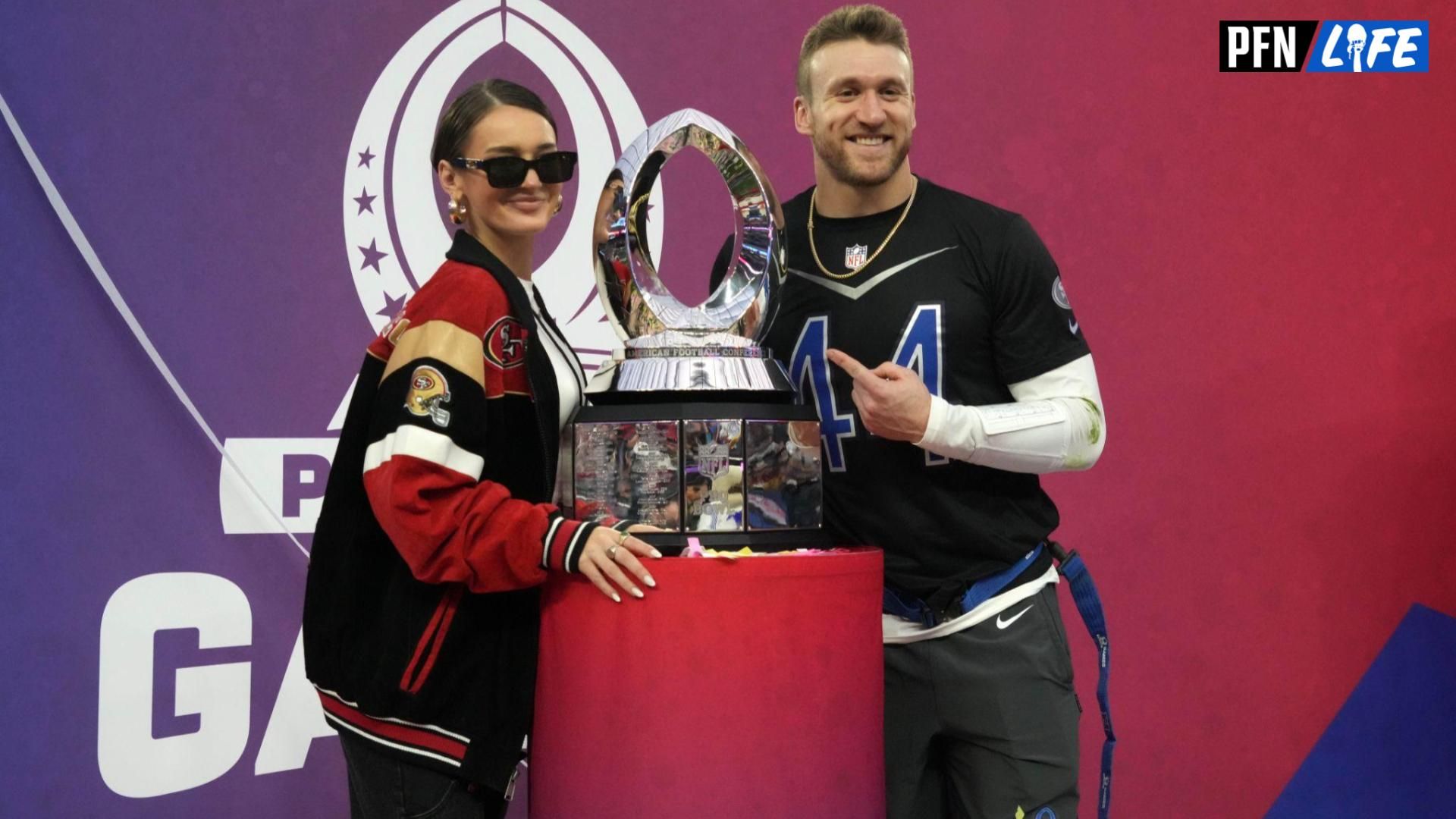 NFC fullback Kyle Juszczyk of the San Francisco 49ers (44) and wife Kristin Juszcyk pose with trophy during the Pro Bowl Games.