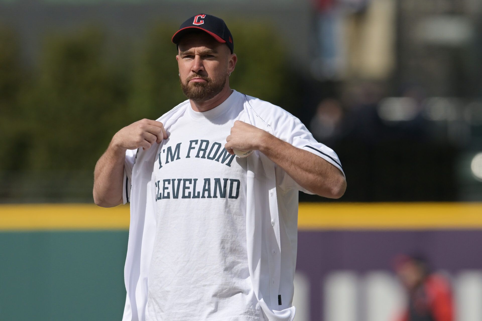 Kansas City Chiefs player Travis Kelce prepares to throw out the first pitch before the game between the Cleveland Guardians and the Seattle Mariners at Progressive Field.