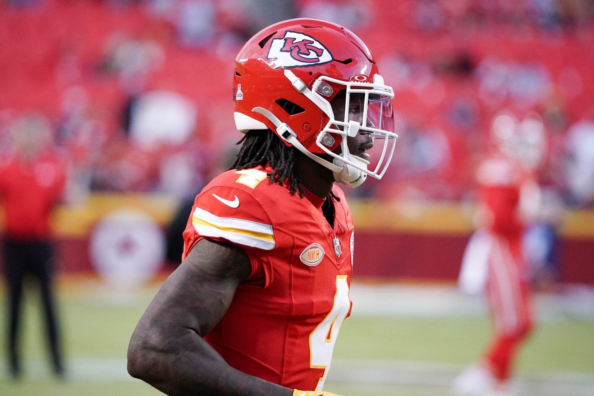 Kansas City Chiefs wide receiver Rashee Rice (4) runs onto the field for warm ups against the Denver Broncos prior to a game at GEHA Field at Arrowhead Stadium.