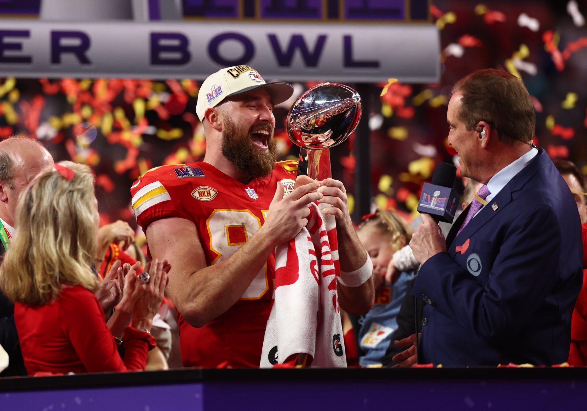 Kansas City Chiefs tight end Travis Kelce (87) celebrates with the Vince Lombardi Trophy after defeating the San Francisco 49ers in Super Bowl LVIII at Allegiant Stadium.