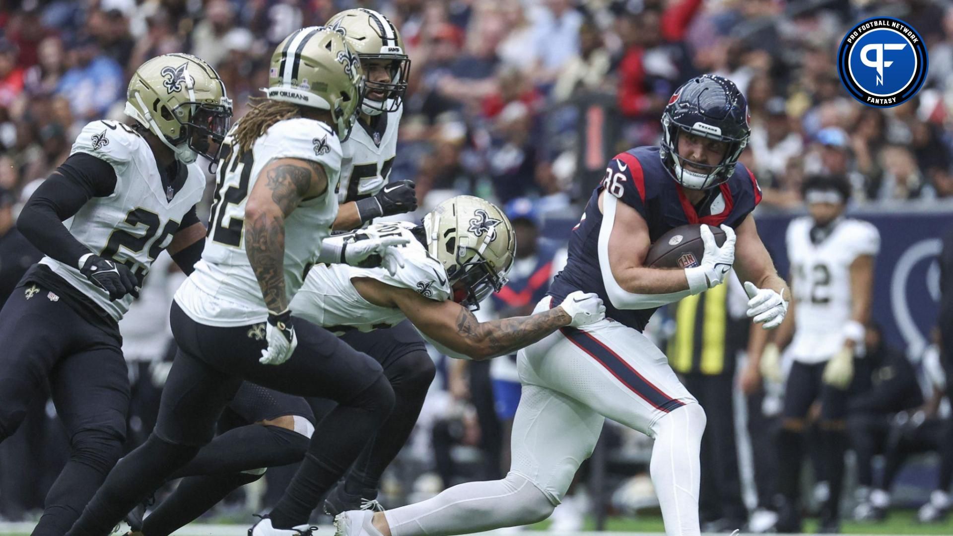 Houston Texans tight end Dalton Schultz (86) runs with the ball as New Orleans Saints cornerback Marshon Lattimore (23) attempts to make a tackle during the third quarter at NRG Stadium.