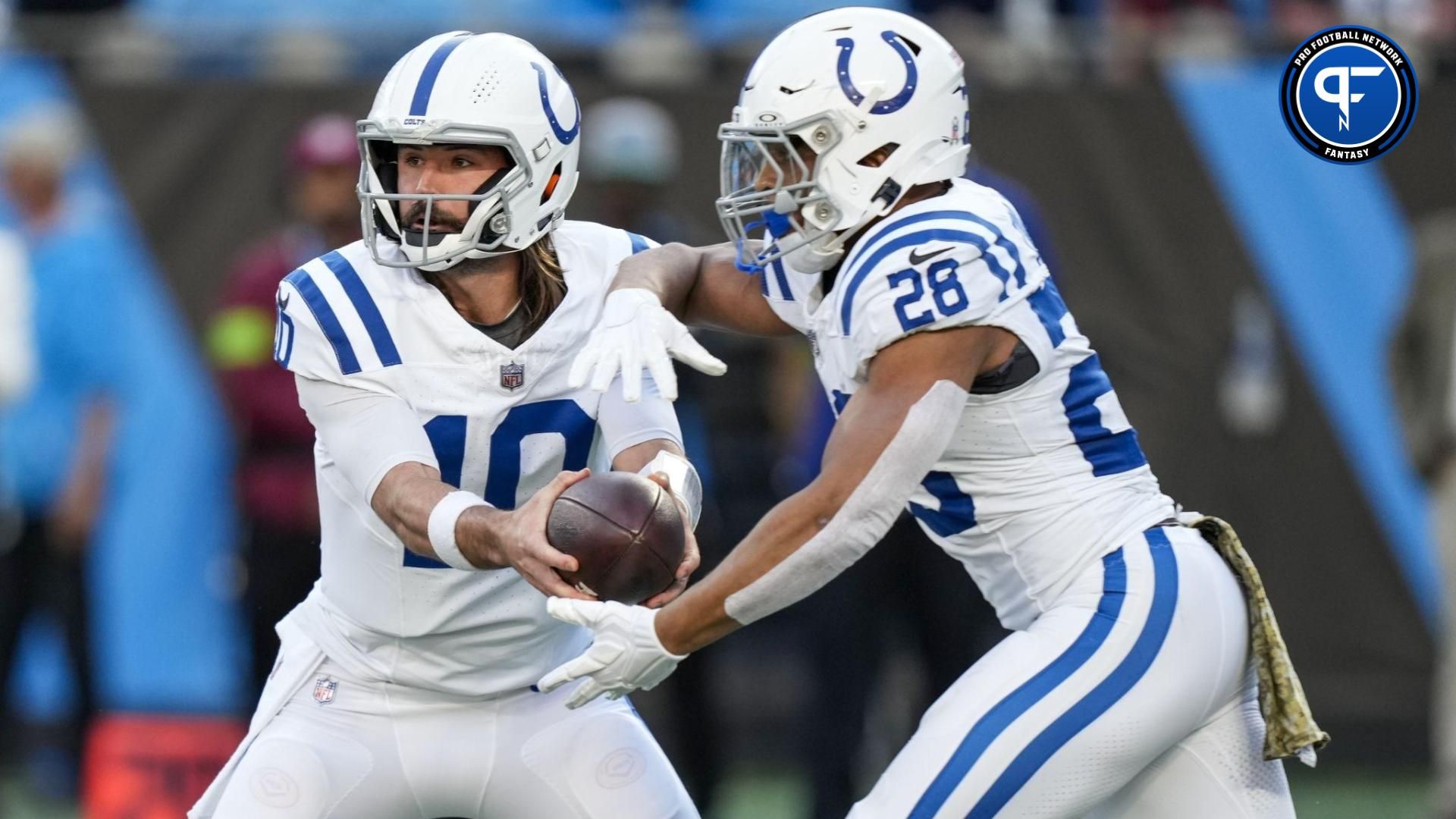 Indianapolis Colts quarterback Gardner Minshew (10) hands off to running back Jonathan Taylor (28) during the first quarter against the Carolina Panthers at Bank of America Stadium.