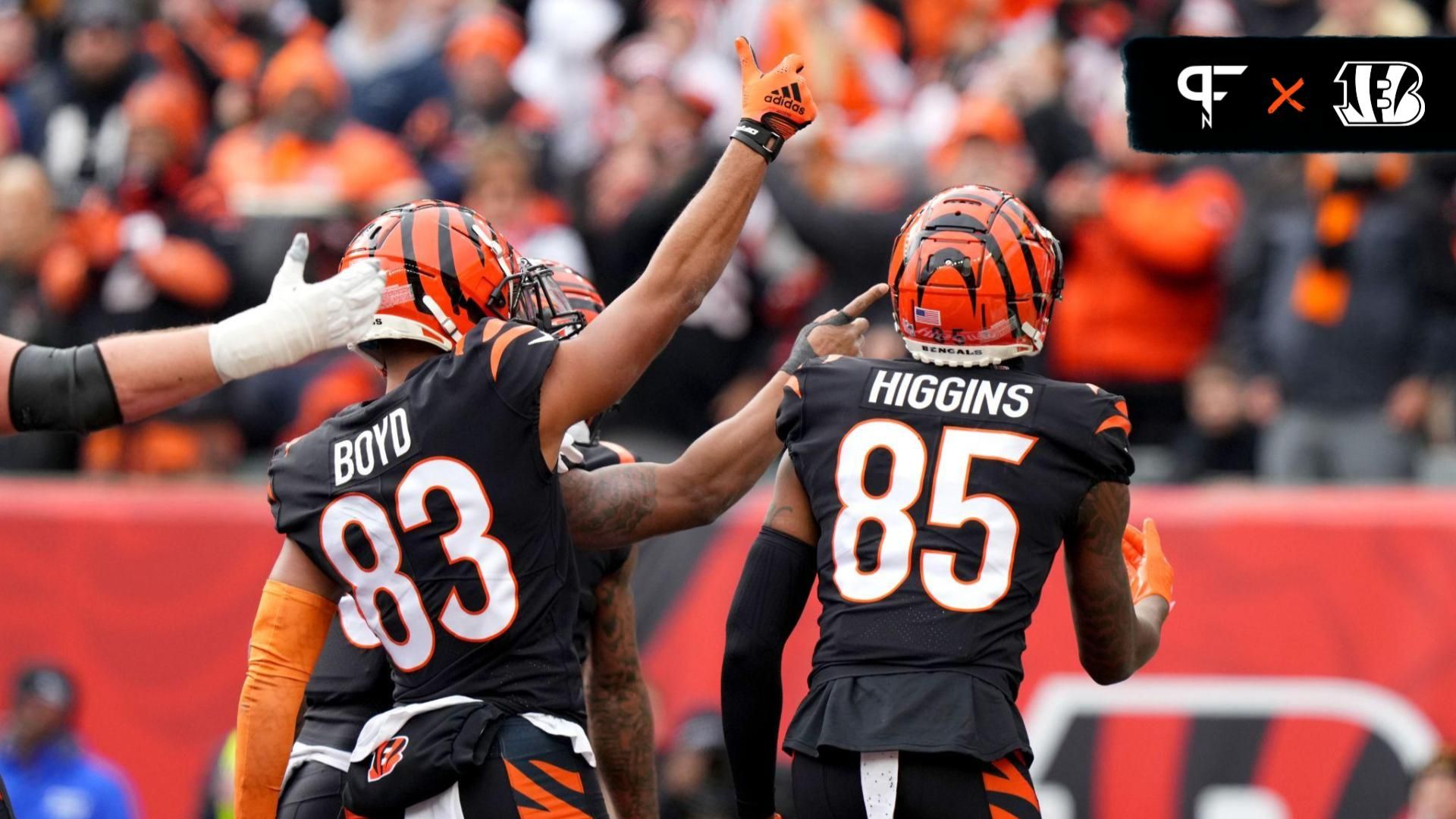 Cincinnati Bengals running back Joe Mixon (28) celebrates a touchdown score with Cincinnati Bengals wide receiver Tyler Boyd (83) and Cincinnati Bengals wide receiver Tee Higgins (85) during the first quarter of a game against the Baltimore Ravens at Paycor Stadium.