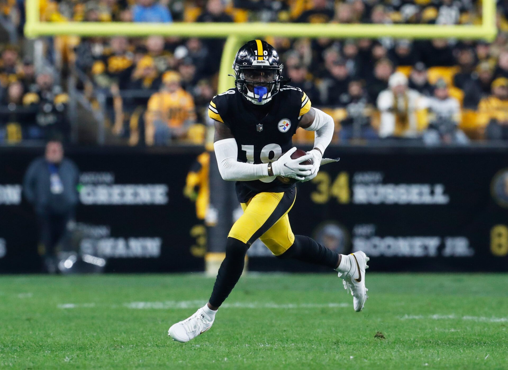 Pittsburgh Steelers wide receiver Diontae Johnson (18) runs after a catch against the Tennessee Titans during the first quarter at Acrisure Stadium.