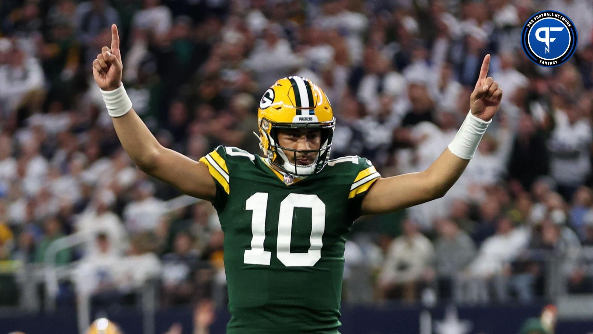 Green Bay Packers quarterback Jordan Love (10) reacts after a touchdown against the Dallas Cowboys in the first quarter for the 2024 NFC wild card game at AT&T Stadium.