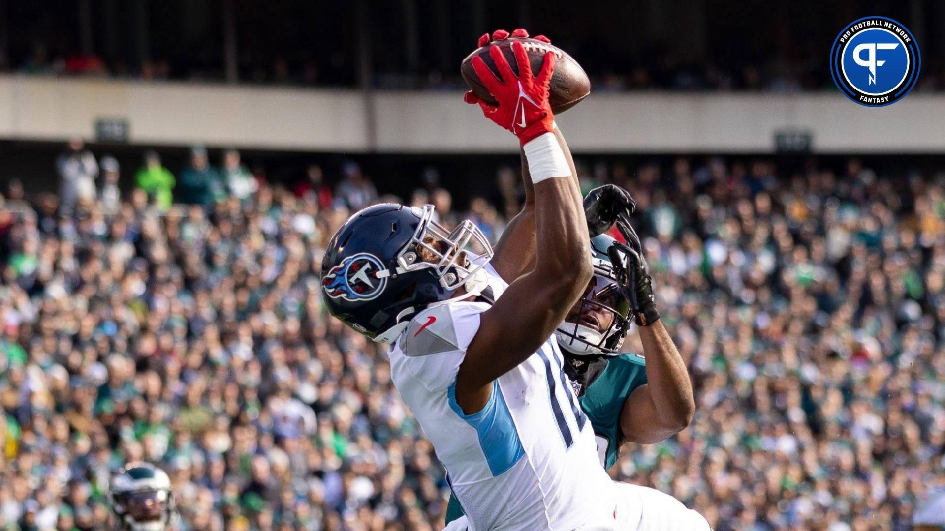 Tennessee Titans wide receiver Treylon Burks (16) makes a touchdown catch in front of Philadelphia Eagles cornerback Josiah Scott (33) during the first quarter at Lincoln Financial Field.