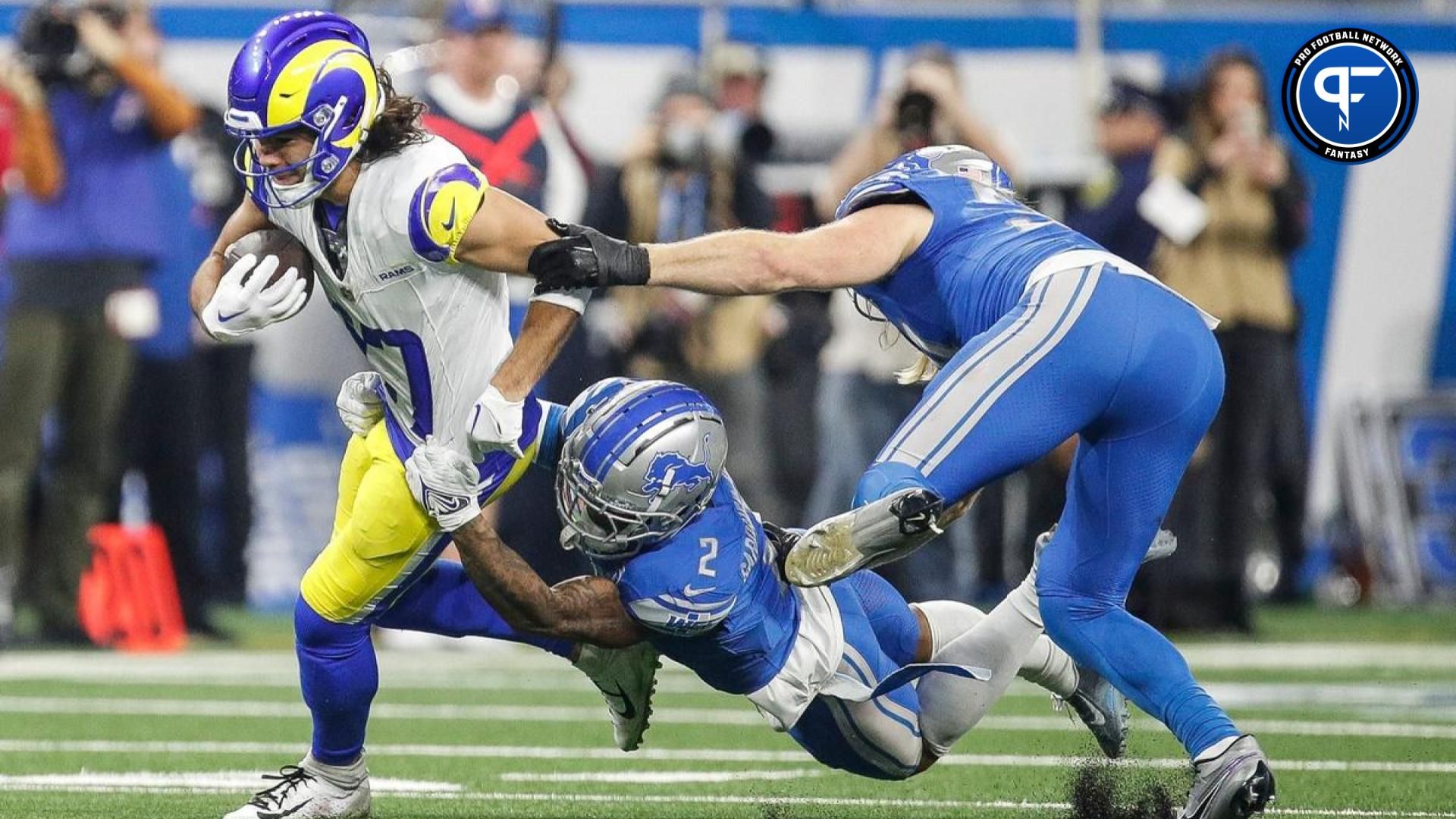 Los Angeles Rams wide receiver Puka Nacua runs against Detroit Lions safety C.J. Gardner-Johnson and linebacker Alex Anzalone during the first half of the NFC wild-card game at Ford Field in Detroit on Sunday, Jan. 14, 2024.