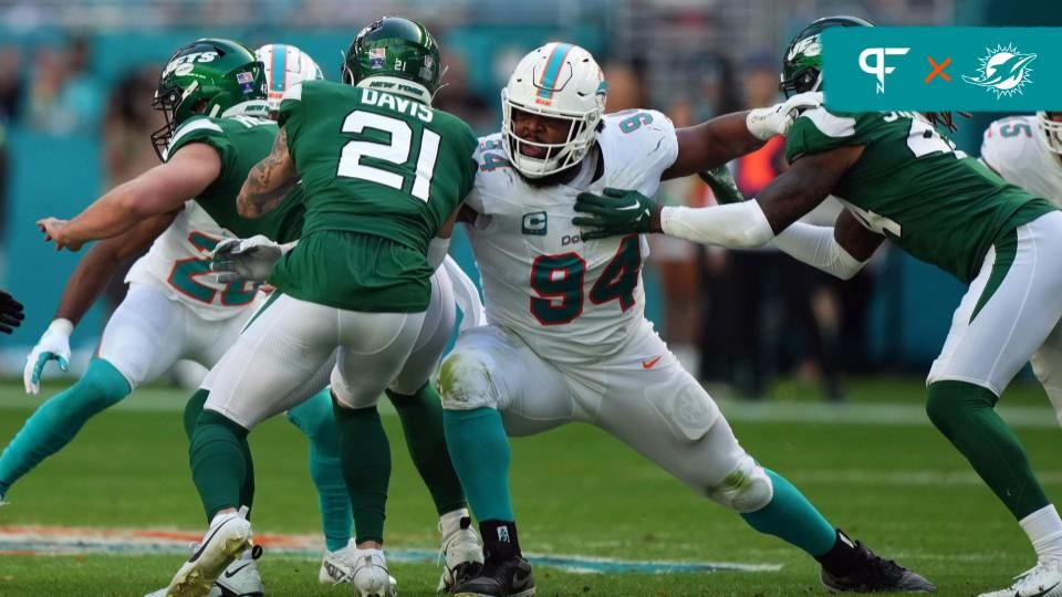 Miami Dolphins defensive tackle Christian Wilkins (94) reaches for New York Jets safety Ashtyn Davis (21) during the first half at Hard Rock Stadium.