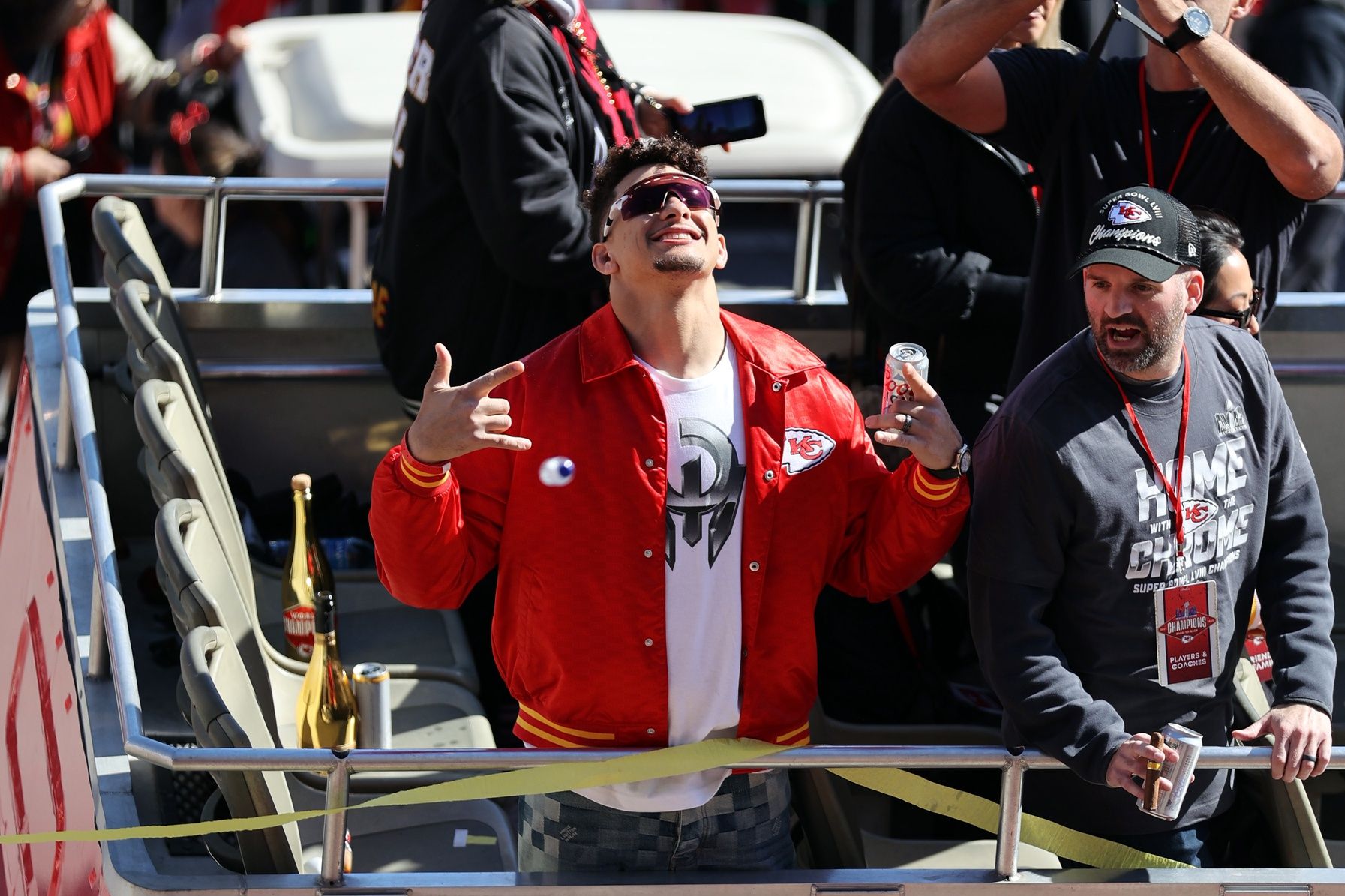 Kansas City Chiefs quarterback Patrick Mahomes (15) celebrates on the bus in the parade during the celebration of the Kansas City Chiefs winning Super Bowl LVIII.