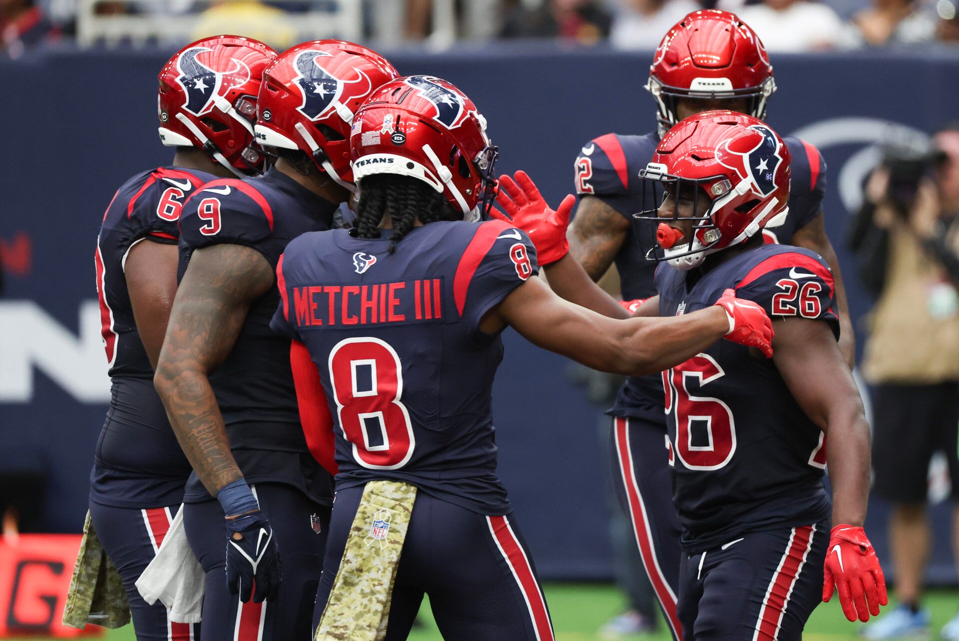 Houston Texans running back Devin Singletary (26) celebrates his rushing touchdown with teammates against the Arizona Cardinals in the second quarter at NRG Stadium.