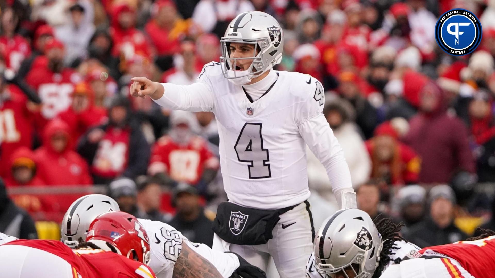 Las Vegas Raiders quarterback Aidan O'Connell (4) gestures at the line of scrimmage against the Kansas City Chiefs during the second half at GEHA Field at Arrowhead Stadium.