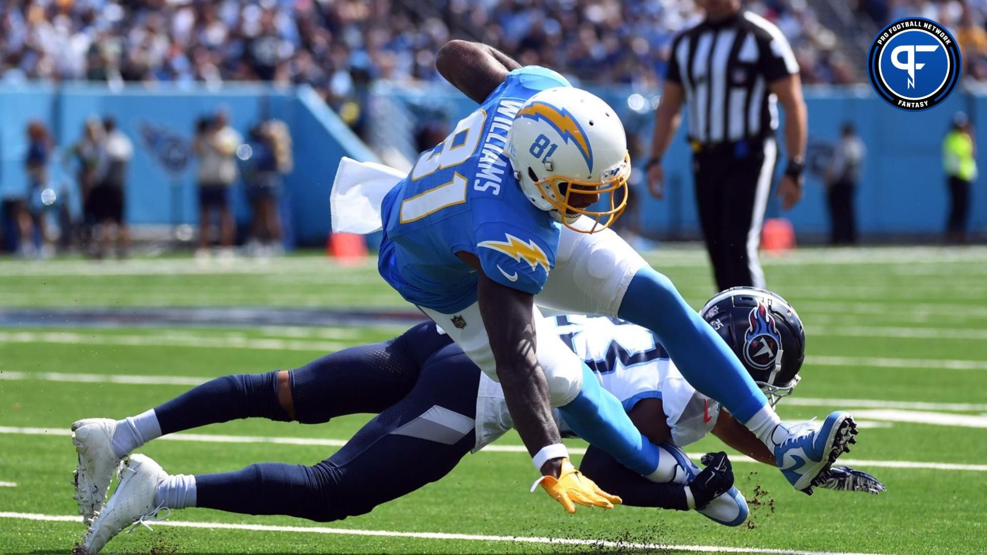 Los Angeles Chargers wide receiver Mike Williams (81) is tackled behind the line by Tennessee Titans cornerback Tre Avery (23) during the first half at Nissan Stadium.