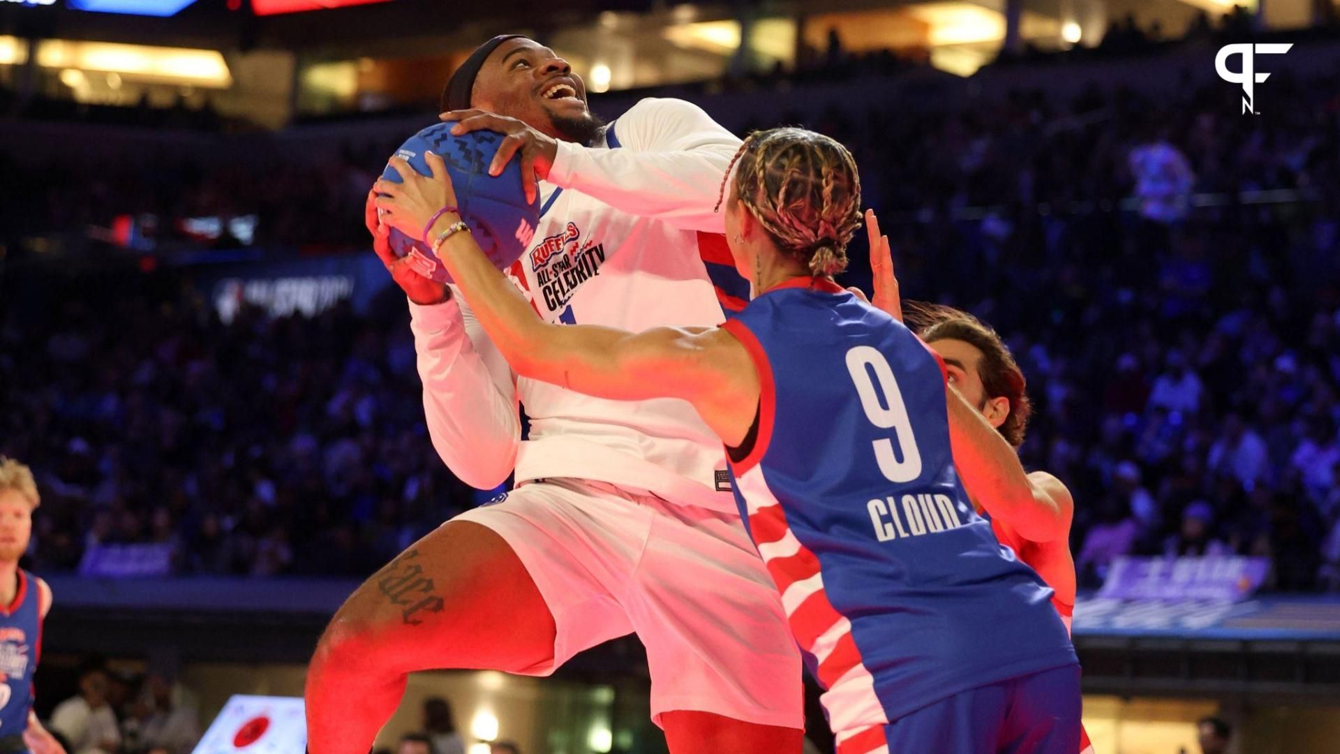 Micah Parsons (11) of Team Shannon shoots against Natasha Cloud (9) of Team Stephen A in the second half during the All Star Celebrity Game at Lucas Oil Stadium.