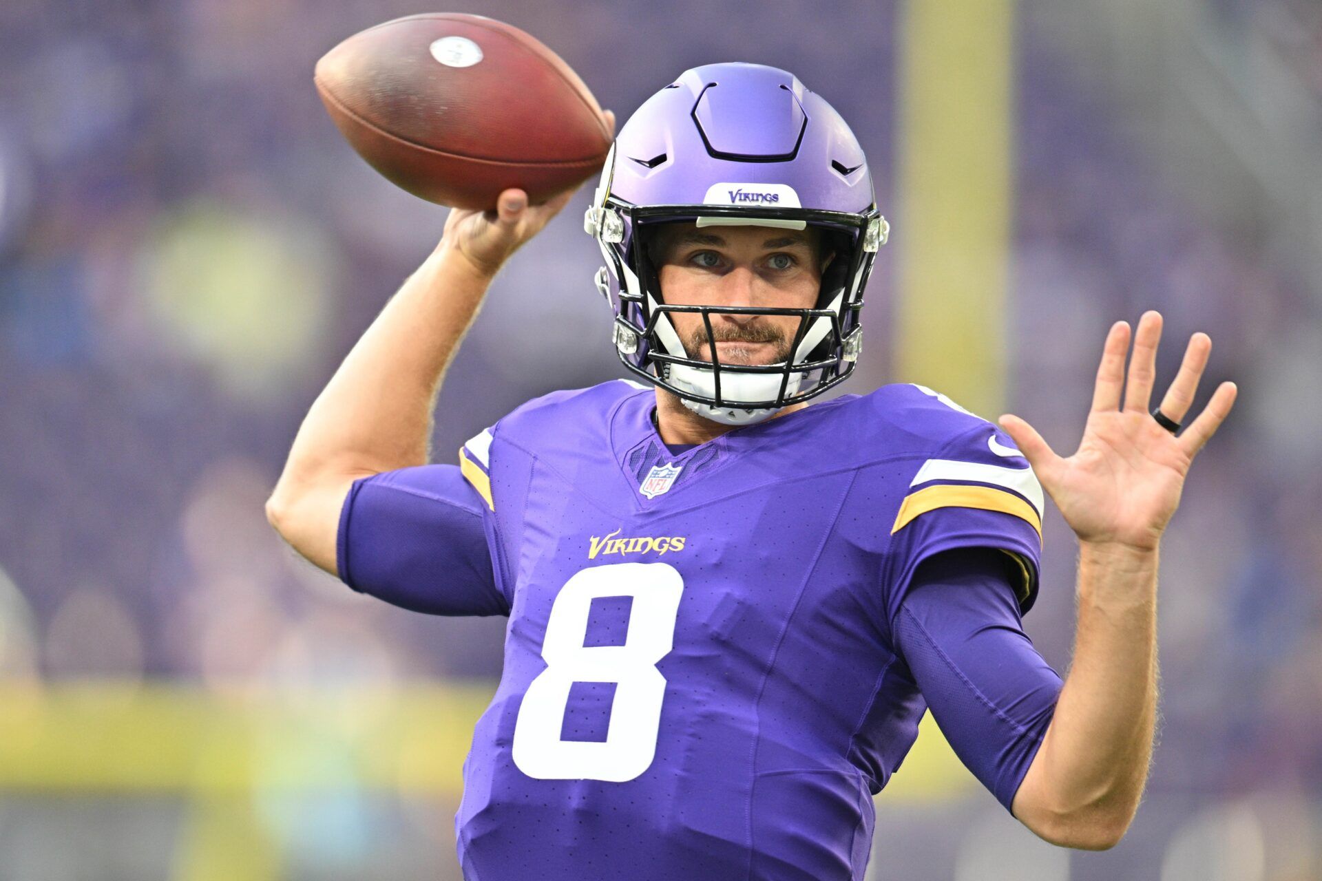 Minnesota Vikings quarterback Kirk Cousins (8) warms up before the game against the Tennessee Titans at U.S. Bank Stadium.