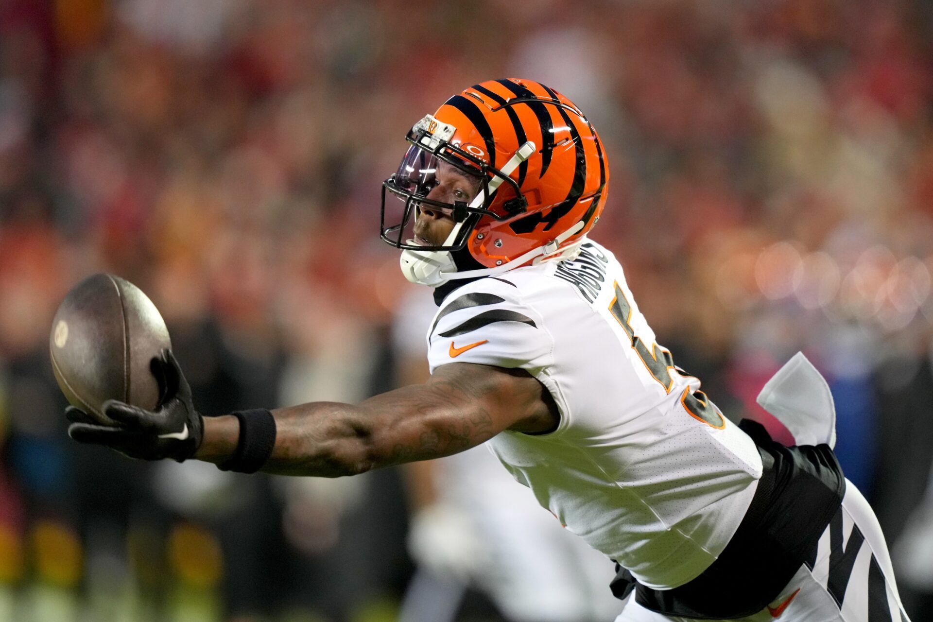 Cincinnati Bengals wide receiver Tee Higgins (5) gets his hand on a deep pass in the third quarter during a Week 17 NFL football game between the Cincinnati Bengals and the Kansas City Chiefs at GEHA Field at Arrowhead Stadium.