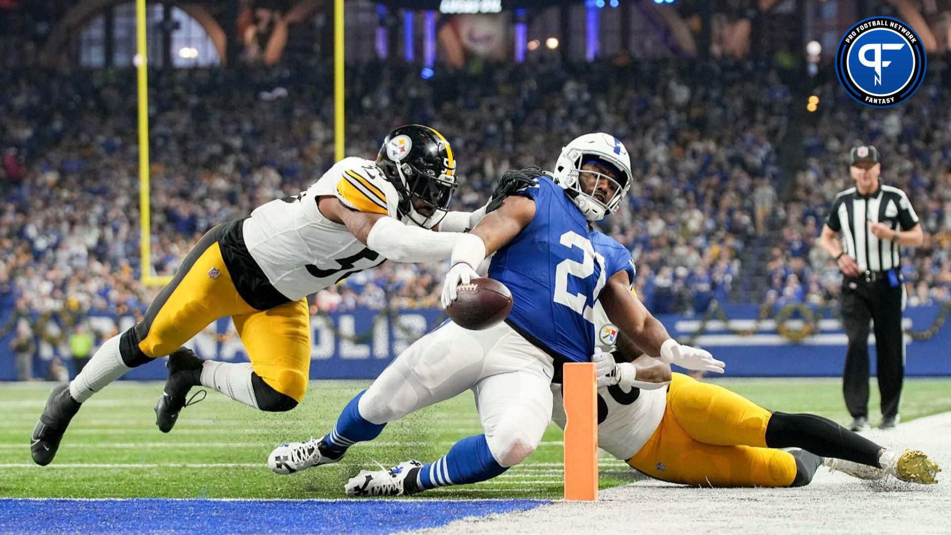 Indianapolis Colts RB Zack Moss (21) slides into the end zone for a touchdown against the Pittsburgh Steelers.