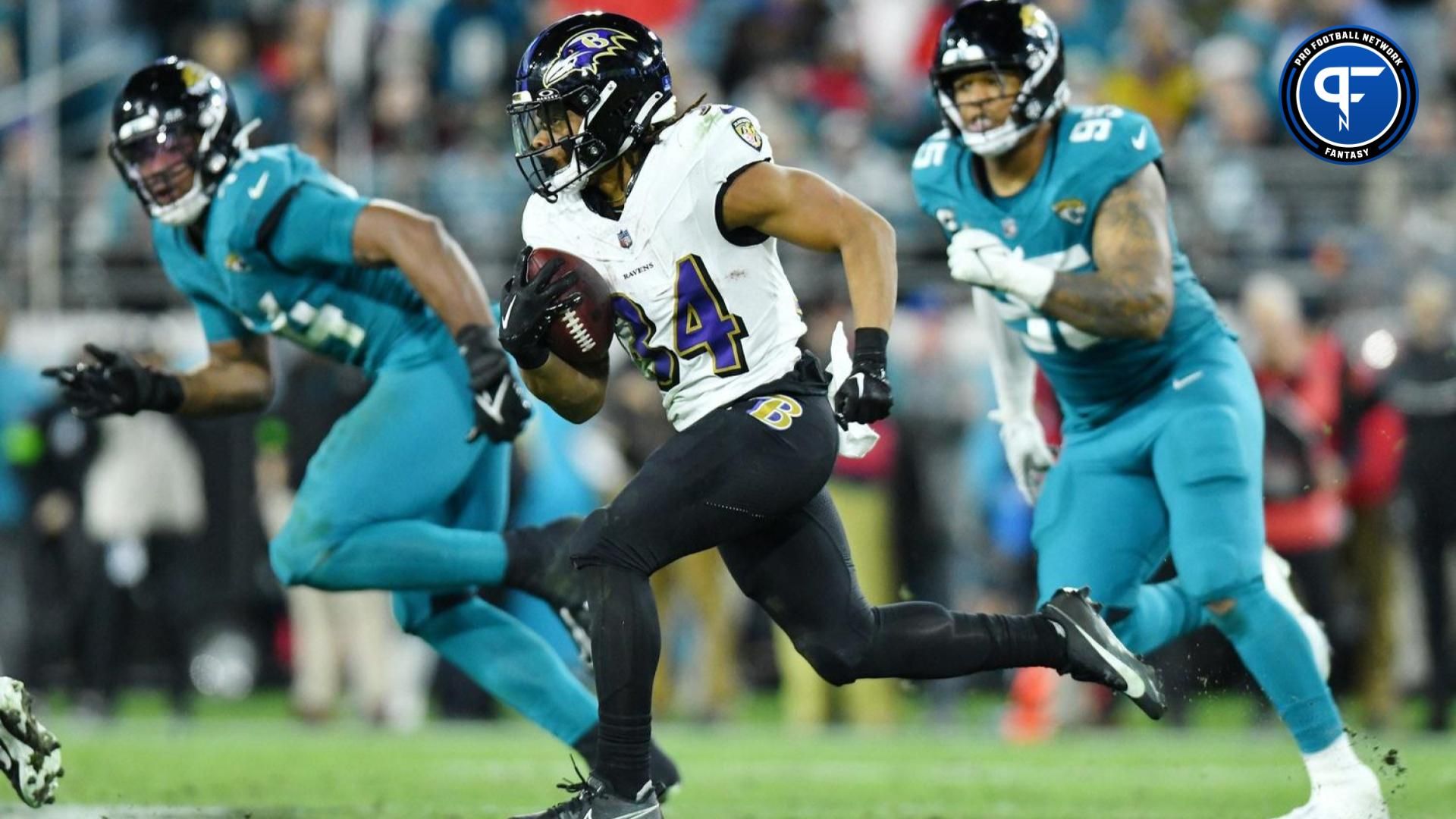 Baltimore Ravens RB Keaton Mitchell (34) runs the ball against the Jacksonville Jaguars.