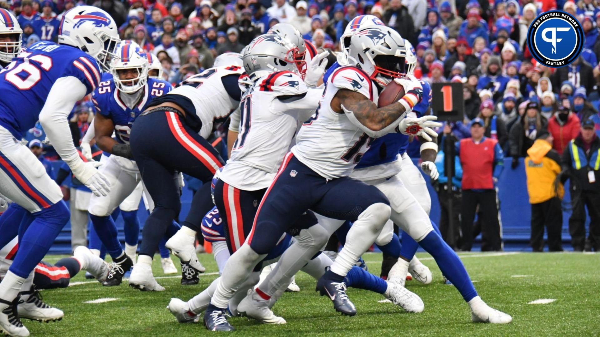 New England Patriots running back Ezekiel Elliott (15) runs for a touchdown against the Buffalo Bills in the fourth quarter at Highmark Stadium.